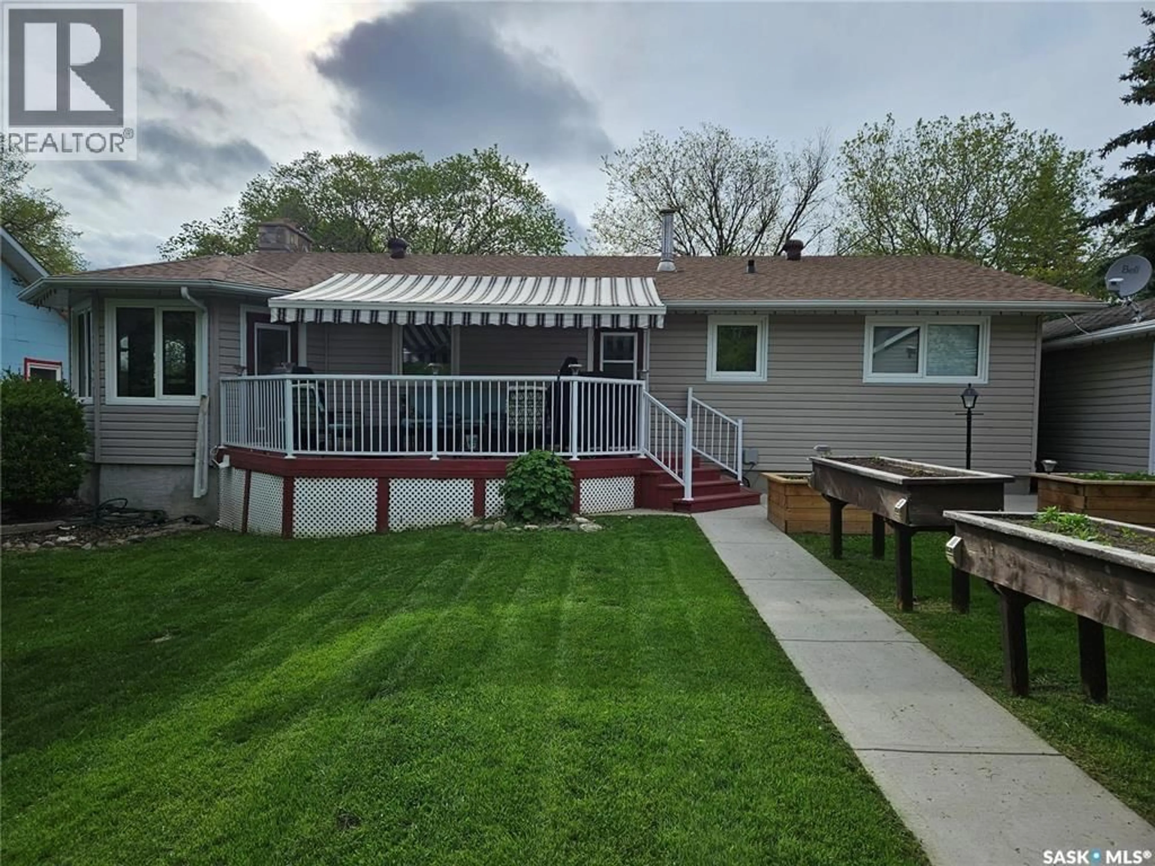 Home with vinyl exterior material, street for 205 1ST E, Carlyle Saskatchewan S0C0R0