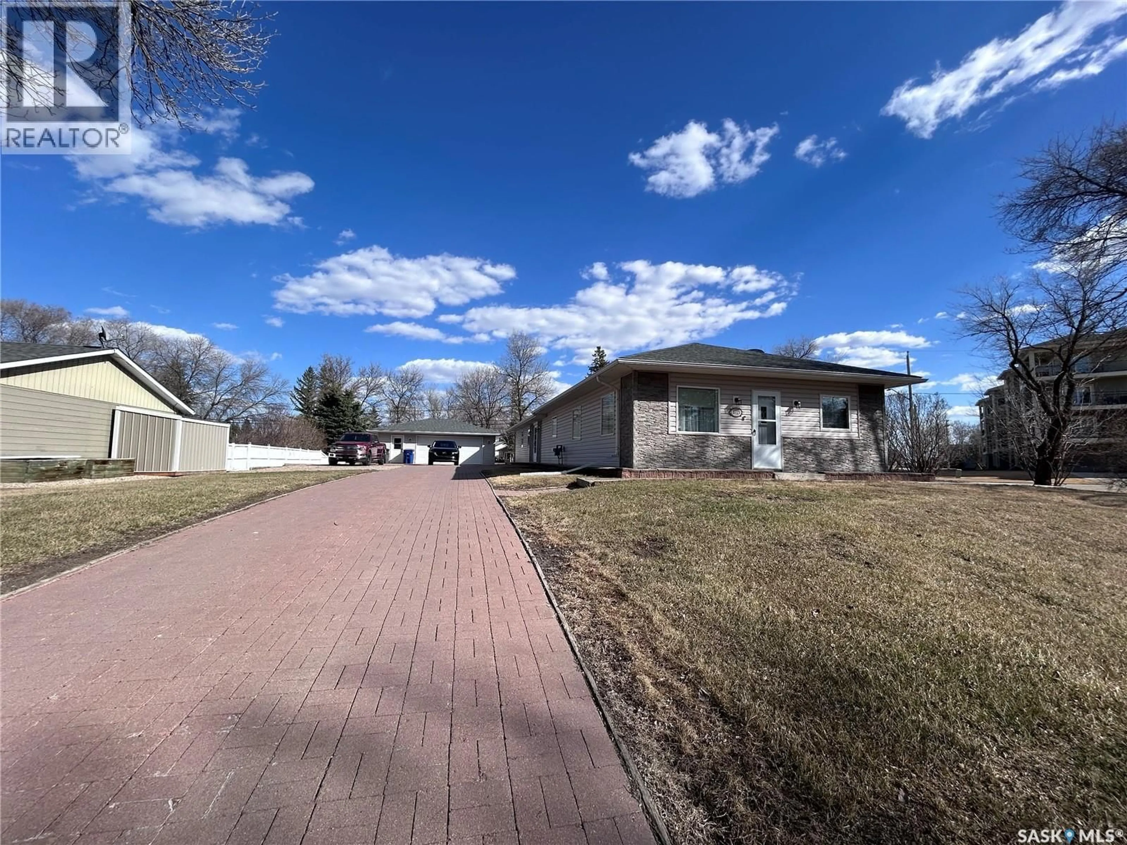 A pic from outside/outdoor area/front of a property/back of a property/a pic from drone, street for 1023 MOUNTAIN STREET, Moosomin Saskatchewan S0G3N0