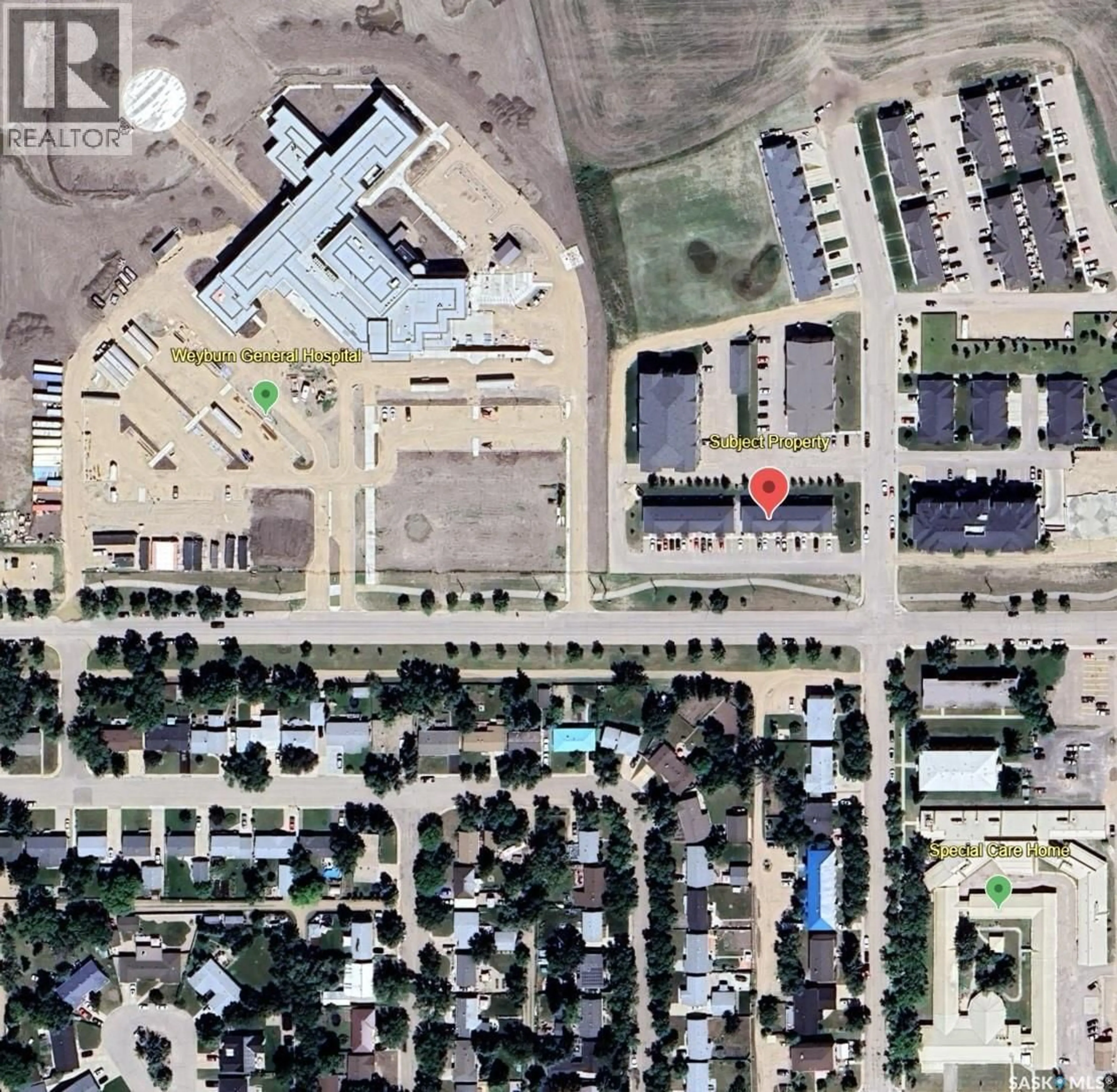 A pic from outside/outdoor area/front of a property/back of a property/a pic from drone, street for 815 - 5 5TH STREET, Weyburn Saskatchewan S4H2K9