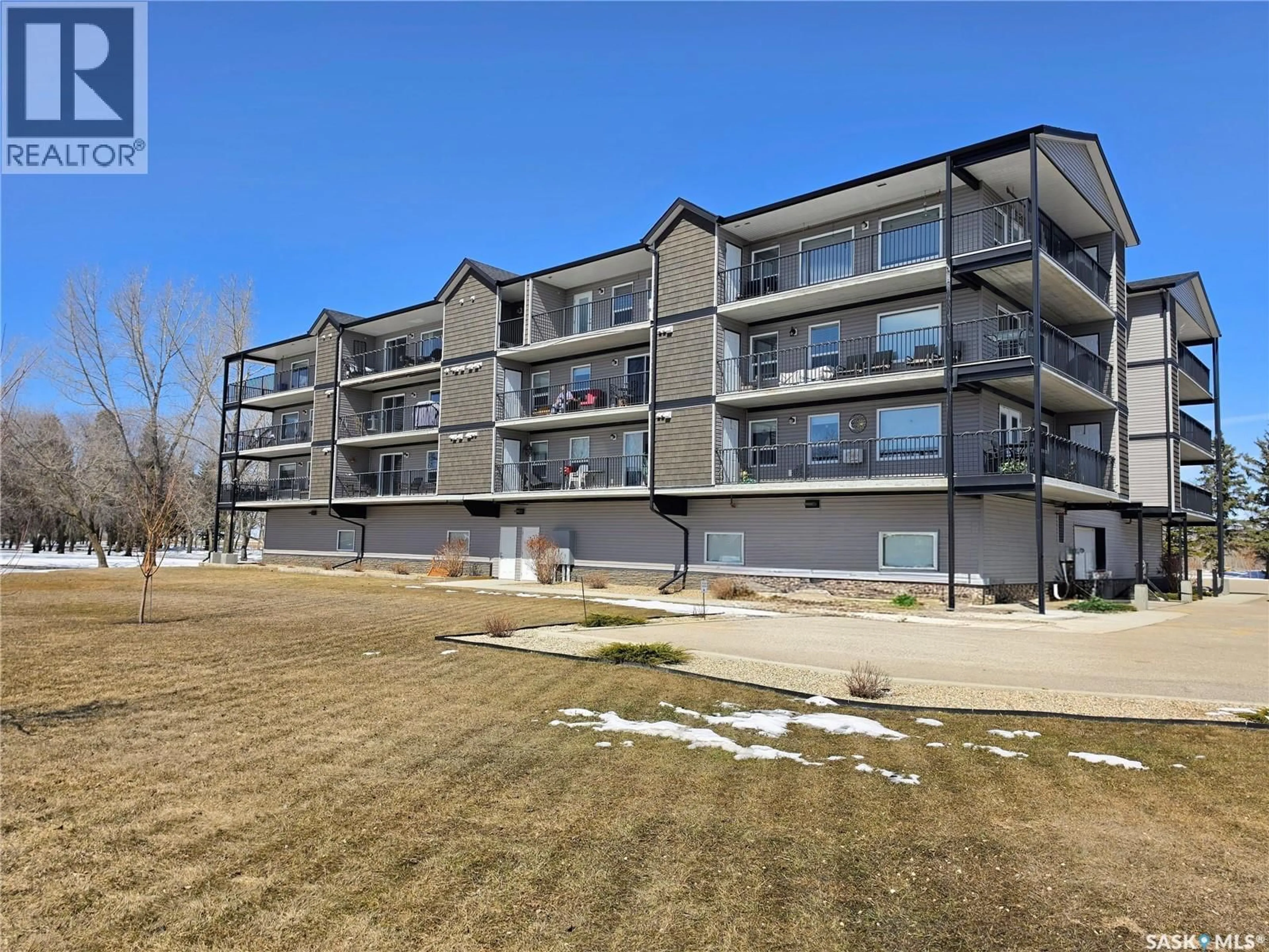 A pic from outside/outdoor area/front of a property/back of a property/a pic from drone, building for 202 1213 9TH STREET, Humboldt Saskatchewan S0K2A0