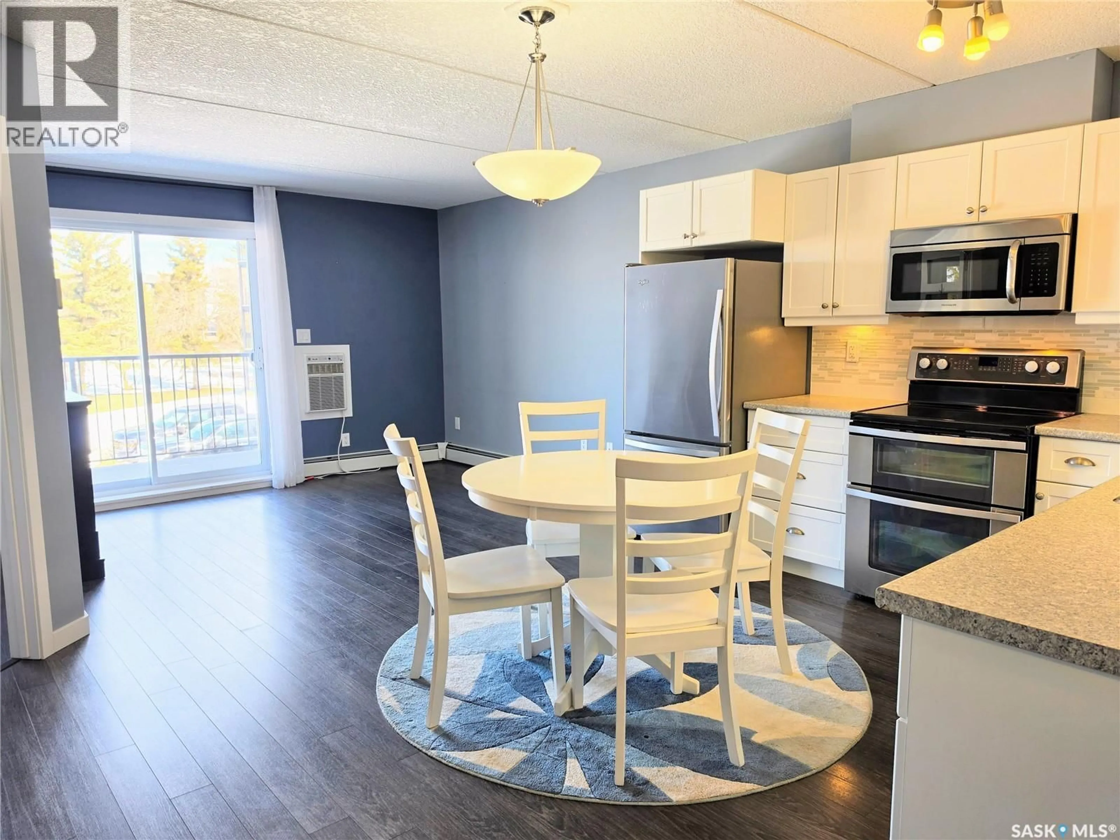 Open concept kitchen, wood/laminate floor for 202 1213 9TH STREET, Humboldt Saskatchewan S0K2A0