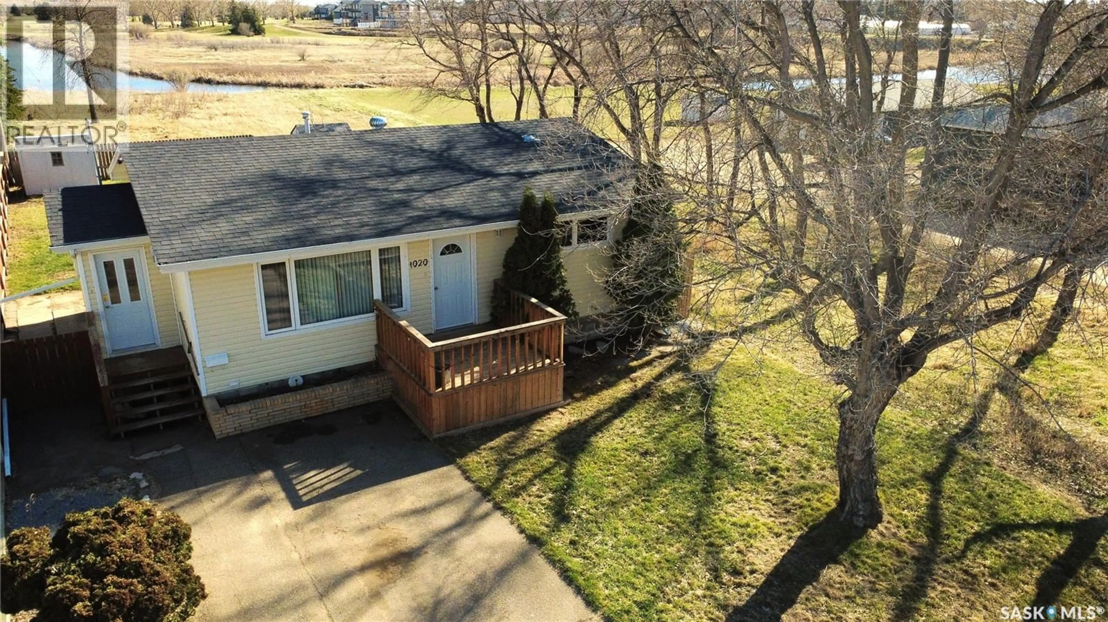 A pic from outside/outdoor area/front of a property/back of a property/a pic from drone, street for 1020 DAHL STREET, Swift Current Saskatchewan S9H3C7