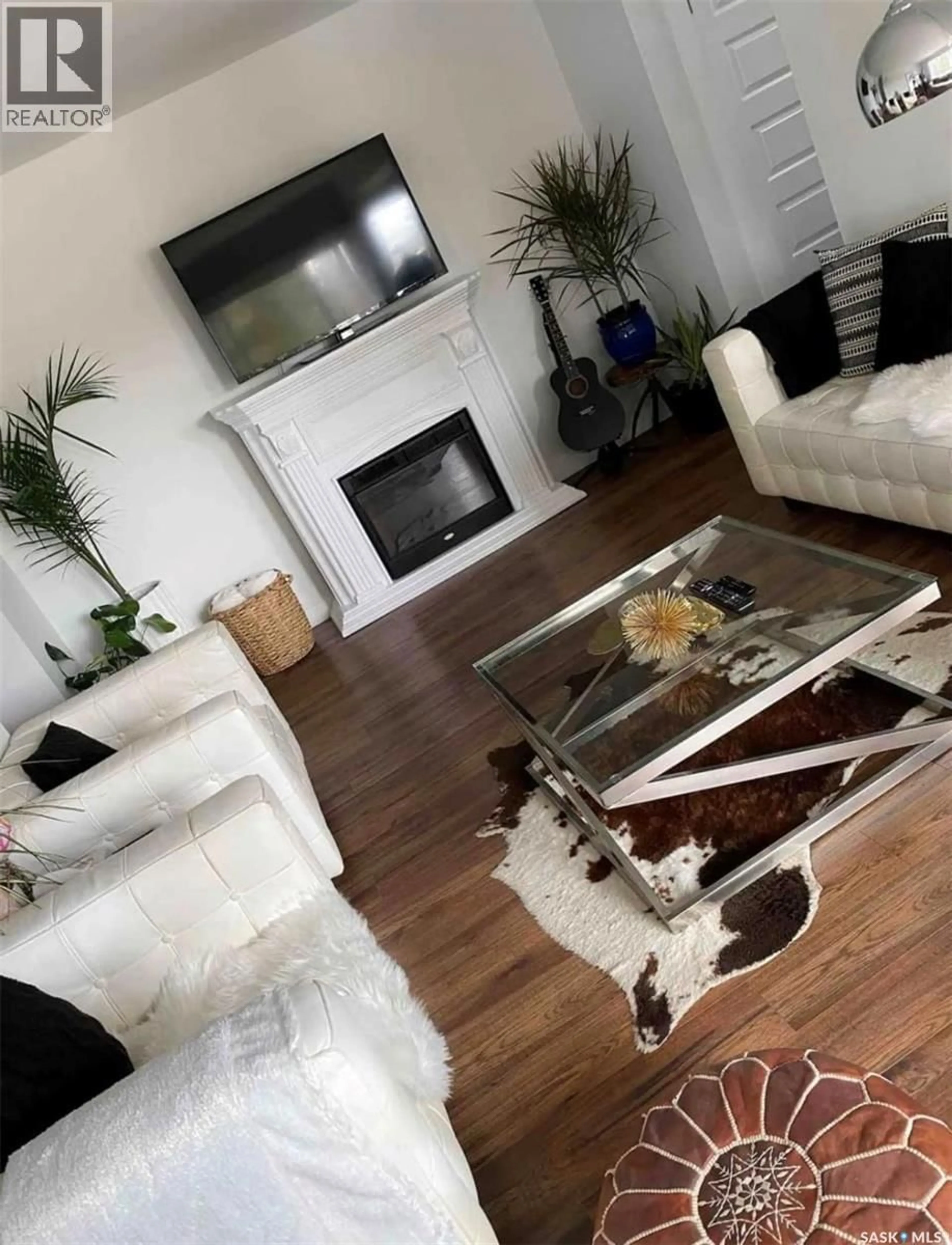 Living room with furniture, wood/laminate floor for 17 208 LINDSAY PLACE, Saskatoon Saskatchewan S7H3E6