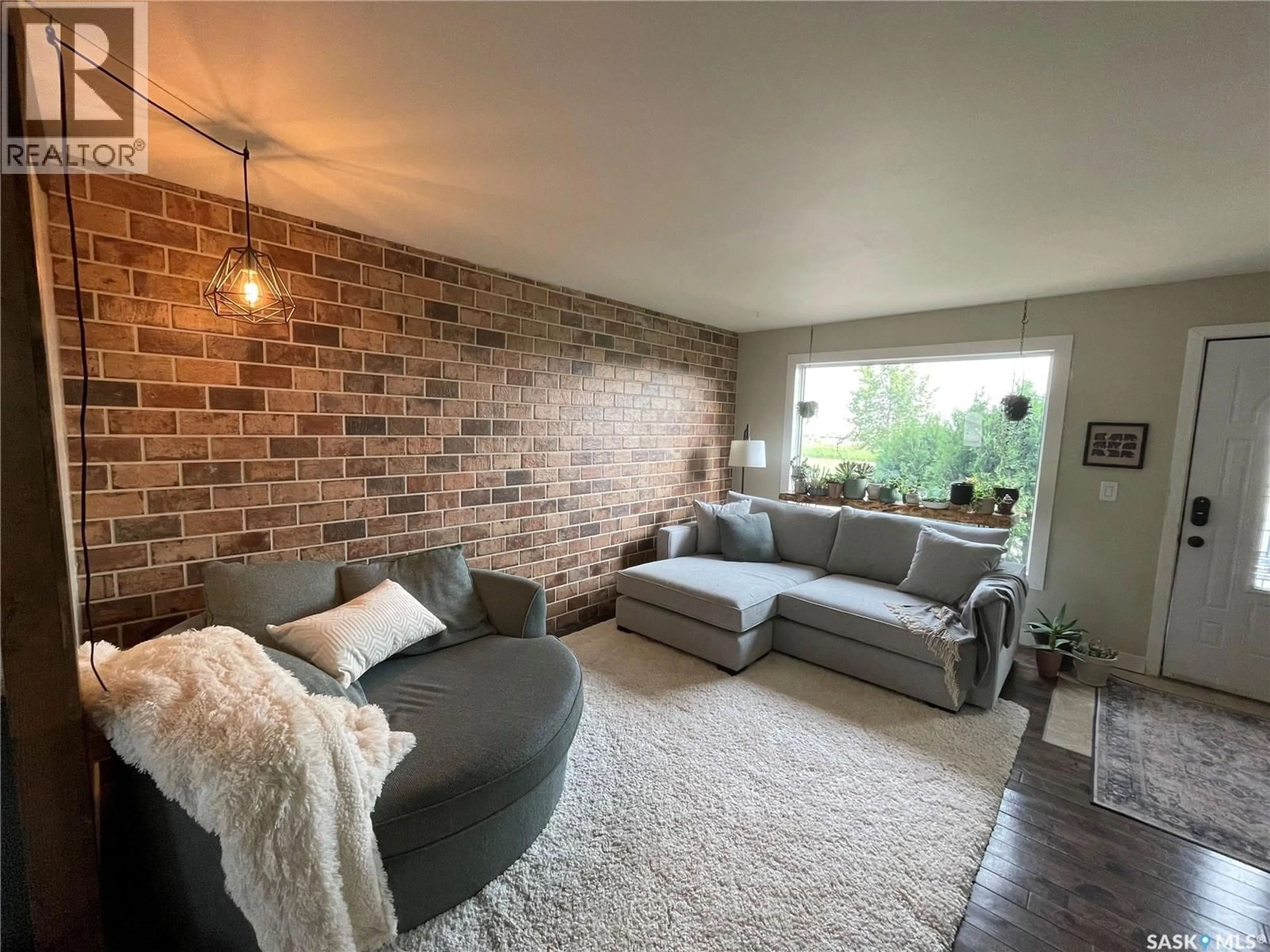 Living room with furniture, unknown for 108 FRONT STREET, Pense Saskatchewan S0G3W0