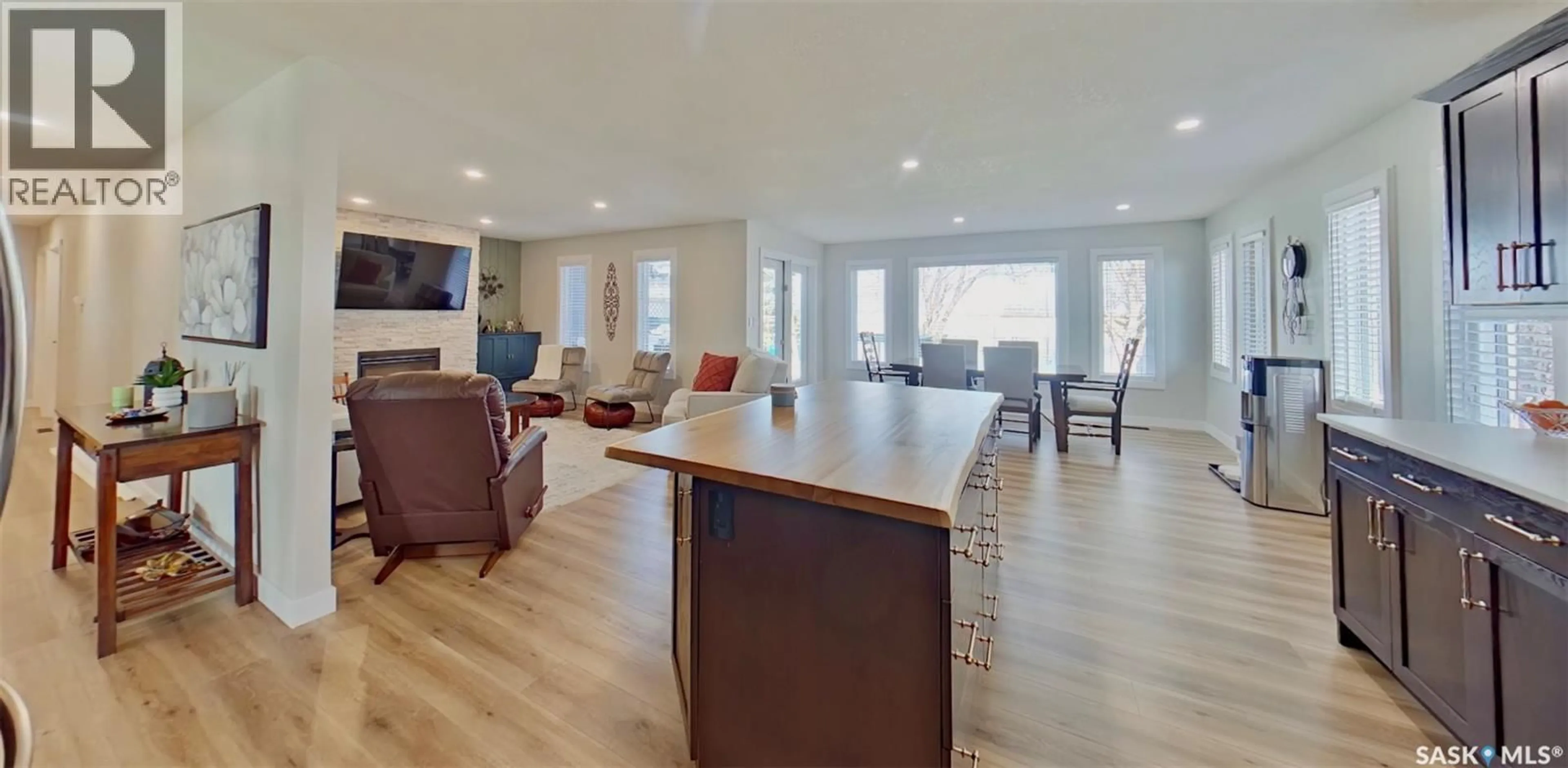 Living room with furniture, wood/laminate floor for 355 RUSSELL STREET, Stoughton Saskatchewan S0G4T0