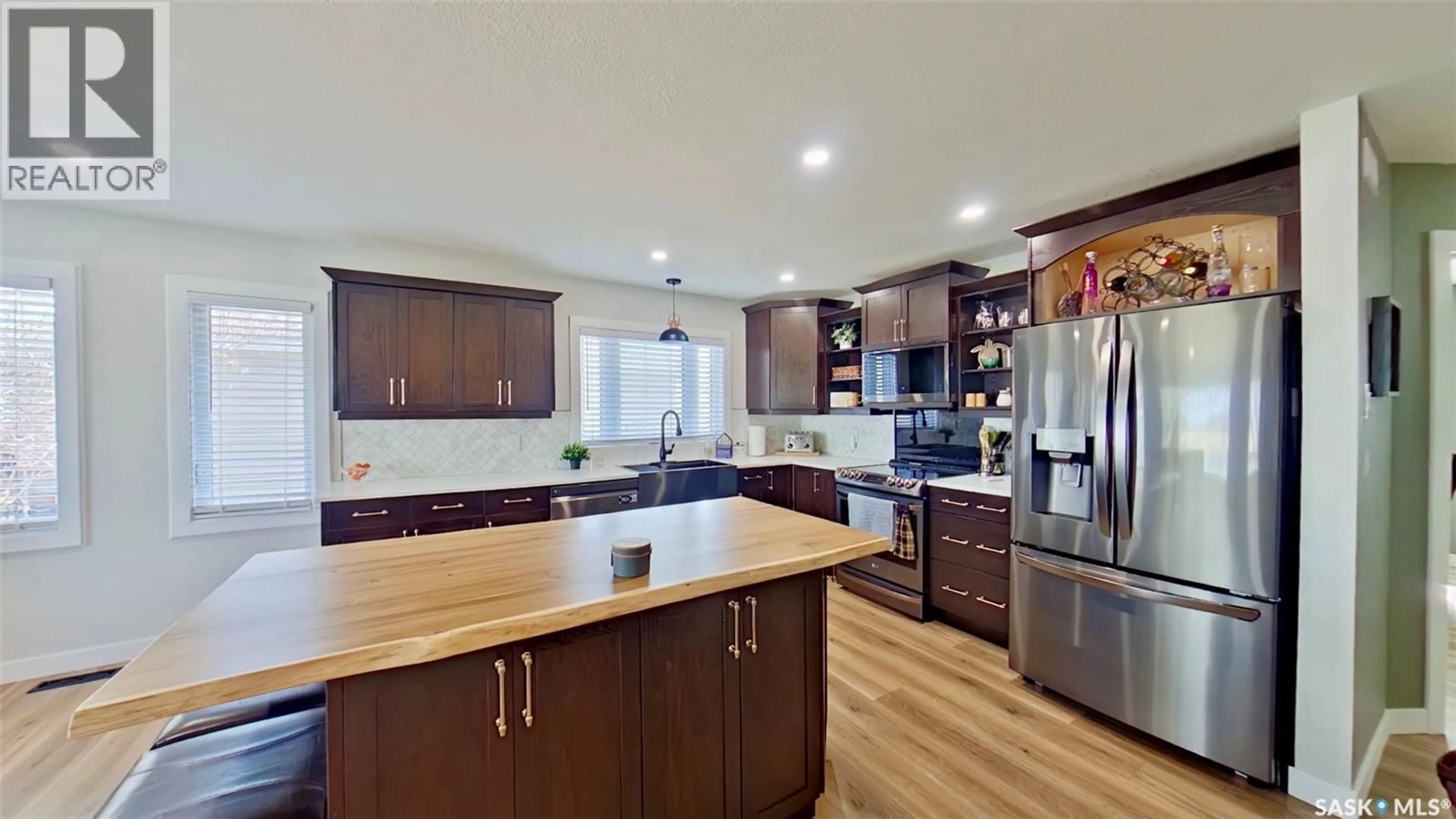 Open concept kitchen, wood/laminate floor for 355 RUSSELL STREET, Stoughton Saskatchewan S0G4T0