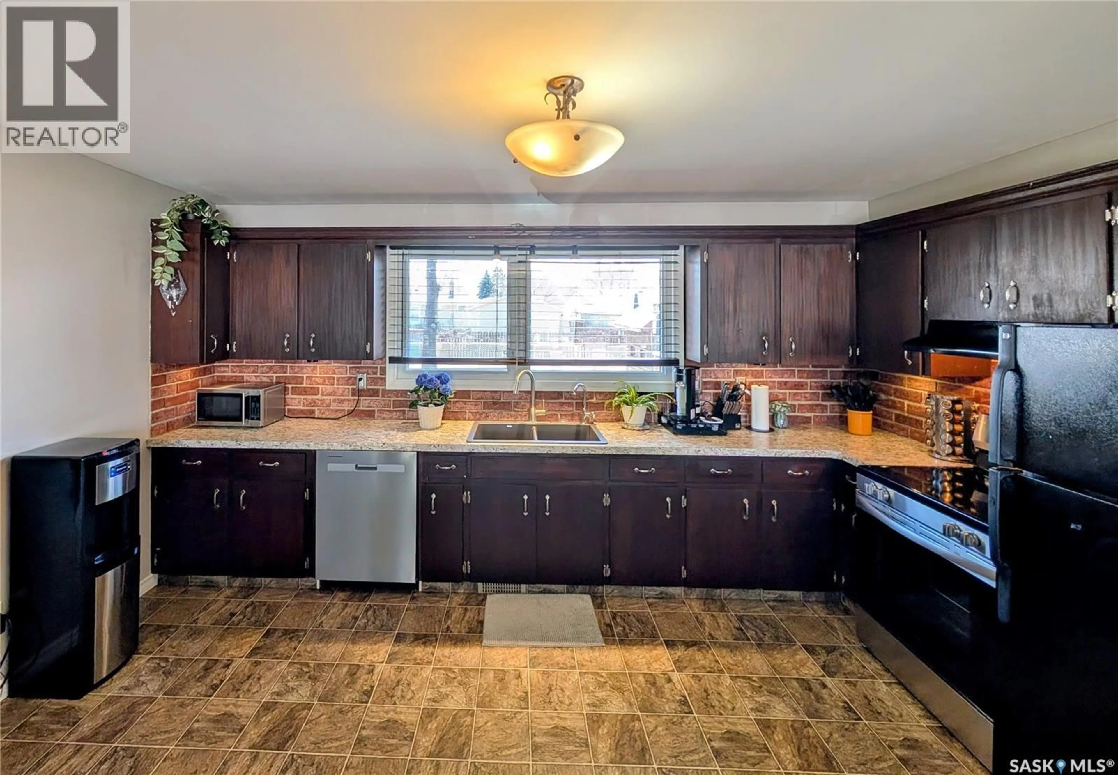 Open concept kitchen, ceramic/tile floor for 102 MOLLARD CRESCENT, Regina Saskatchewan S4T6J5