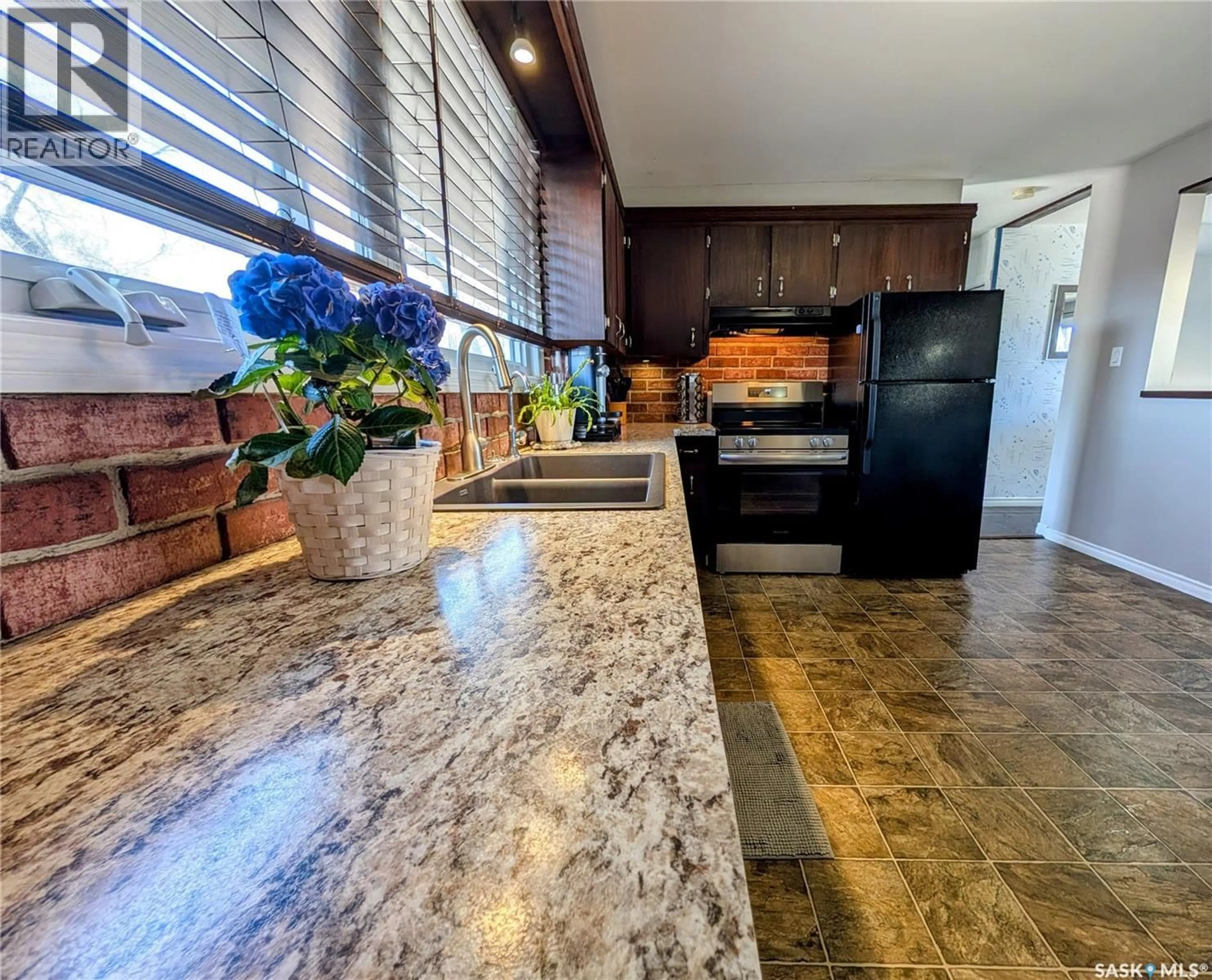 Open concept kitchen, ceramic/tile floor for 102 MOLLARD CRESCENT, Regina Saskatchewan S4T6J5