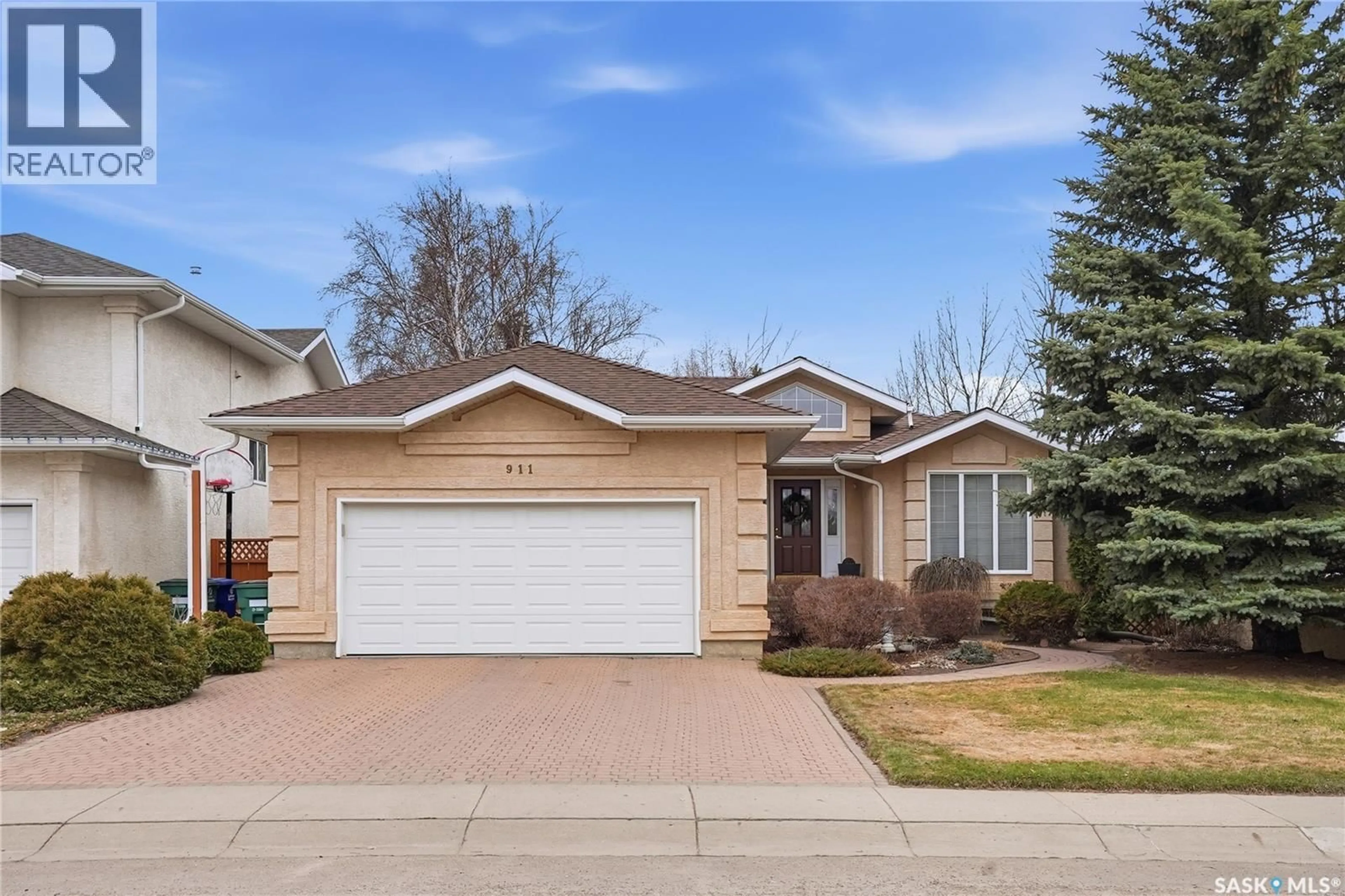 Home with vinyl exterior material, street for 911 CHOTEM CRESCENT, Saskatoon Saskatchewan S7N4N3