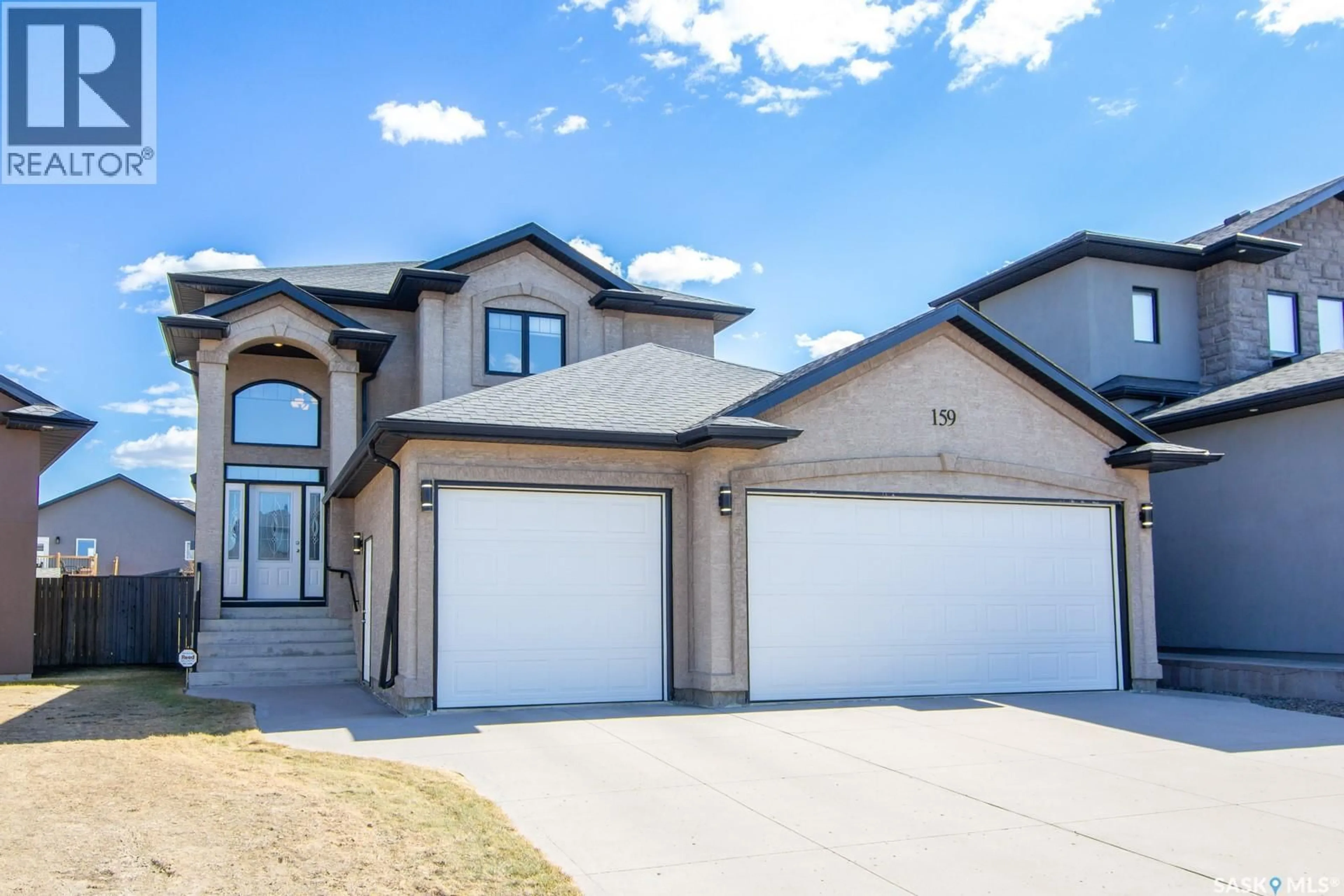 Home with vinyl exterior material, street for 159 MASUDA TERRACE, Saskatoon Saskatchewan S7W0G9