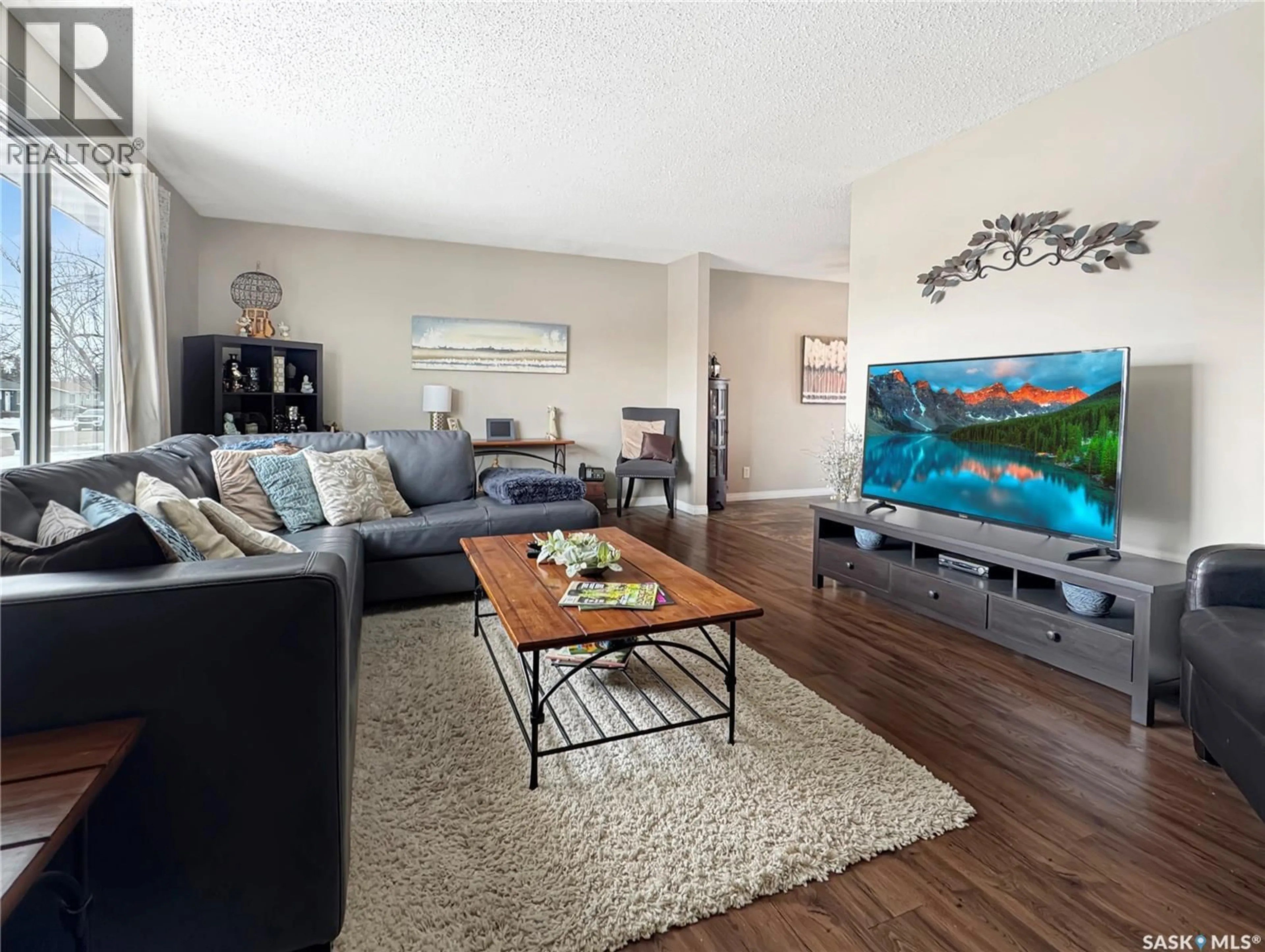 Living room with furniture, wood/laminate floor for 10931 SCOTT DRIVE, North Battleford Saskatchewan S9A3N2