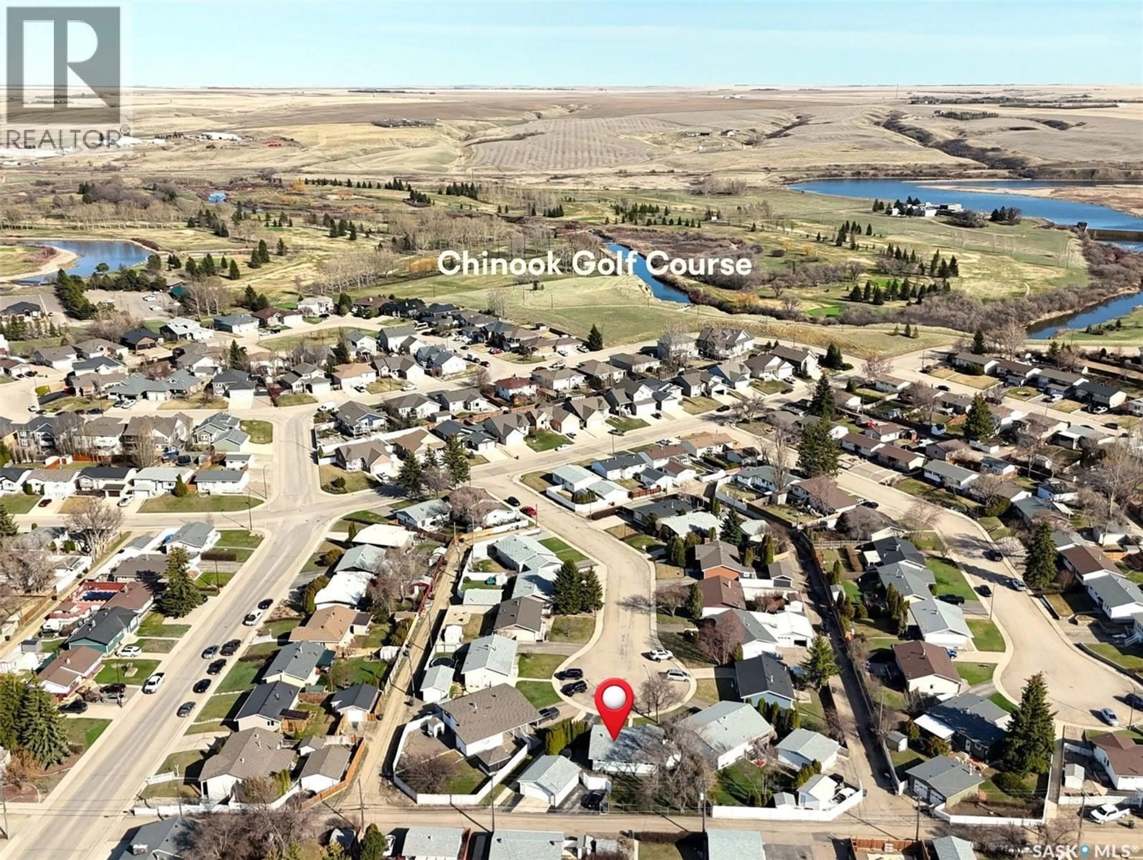 A pic from outside/outdoor area/front of a property/back of a property/a pic from drone, water/lake/river/ocean view for 300 ASH PLACE, Swift Current Saskatchewan S9H3E4