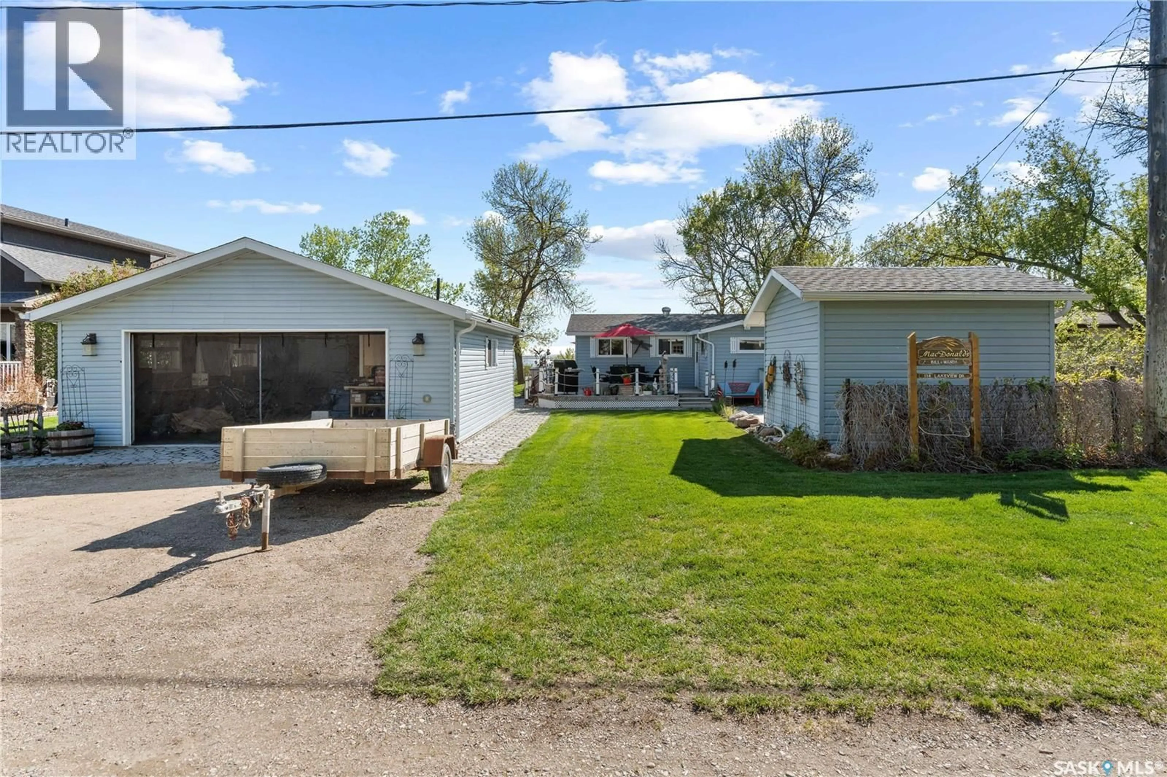 A pic from outside/outdoor area/front of a property/back of a property/a pic from drone, street for 134 LAKEVIEW DRIVE, Island View Saskatchewan S0G0L0