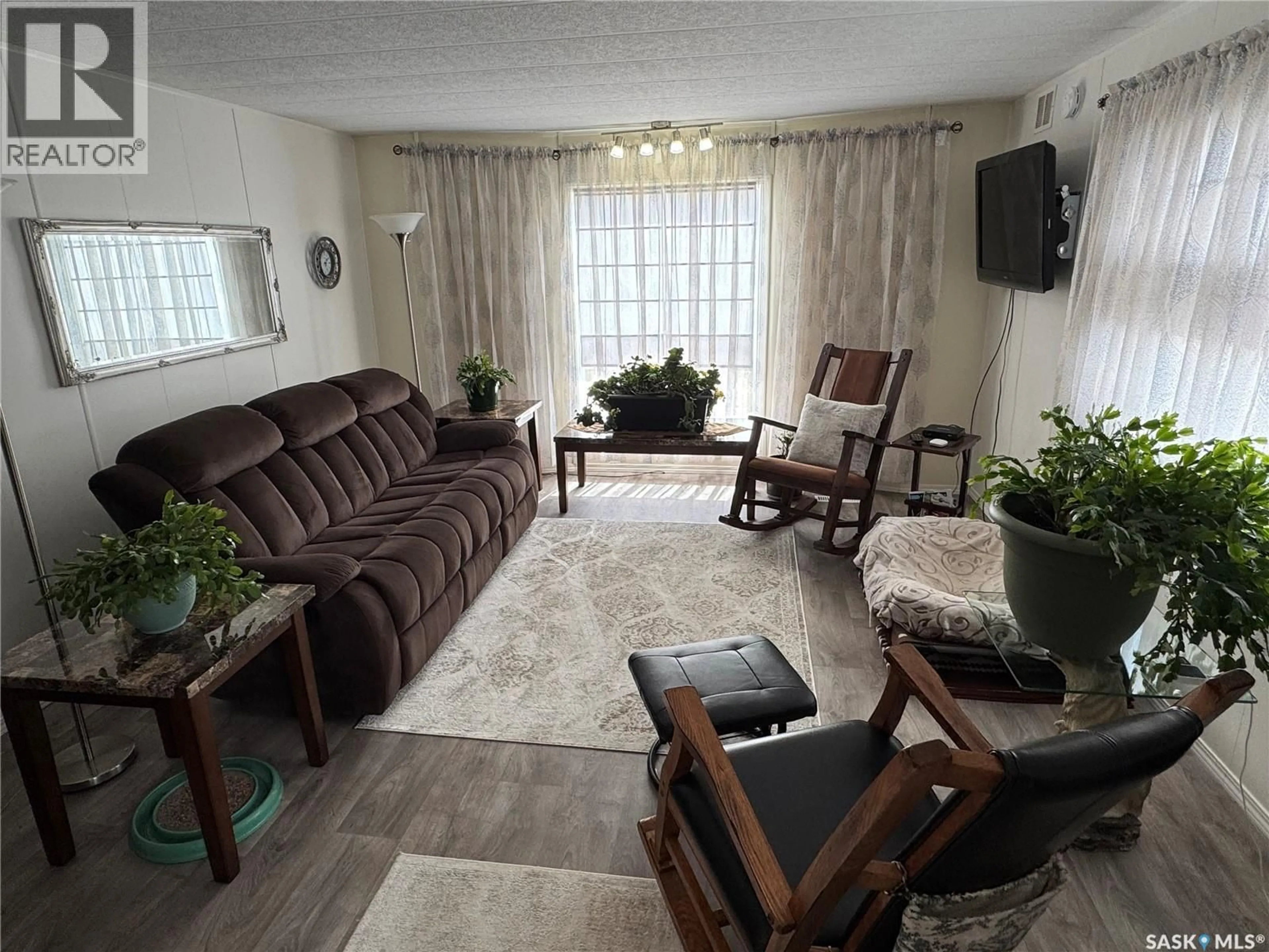 Living room with furniture, unknown for 357 10TH AVENUE, Weyburn Saskatchewan S4H3L8