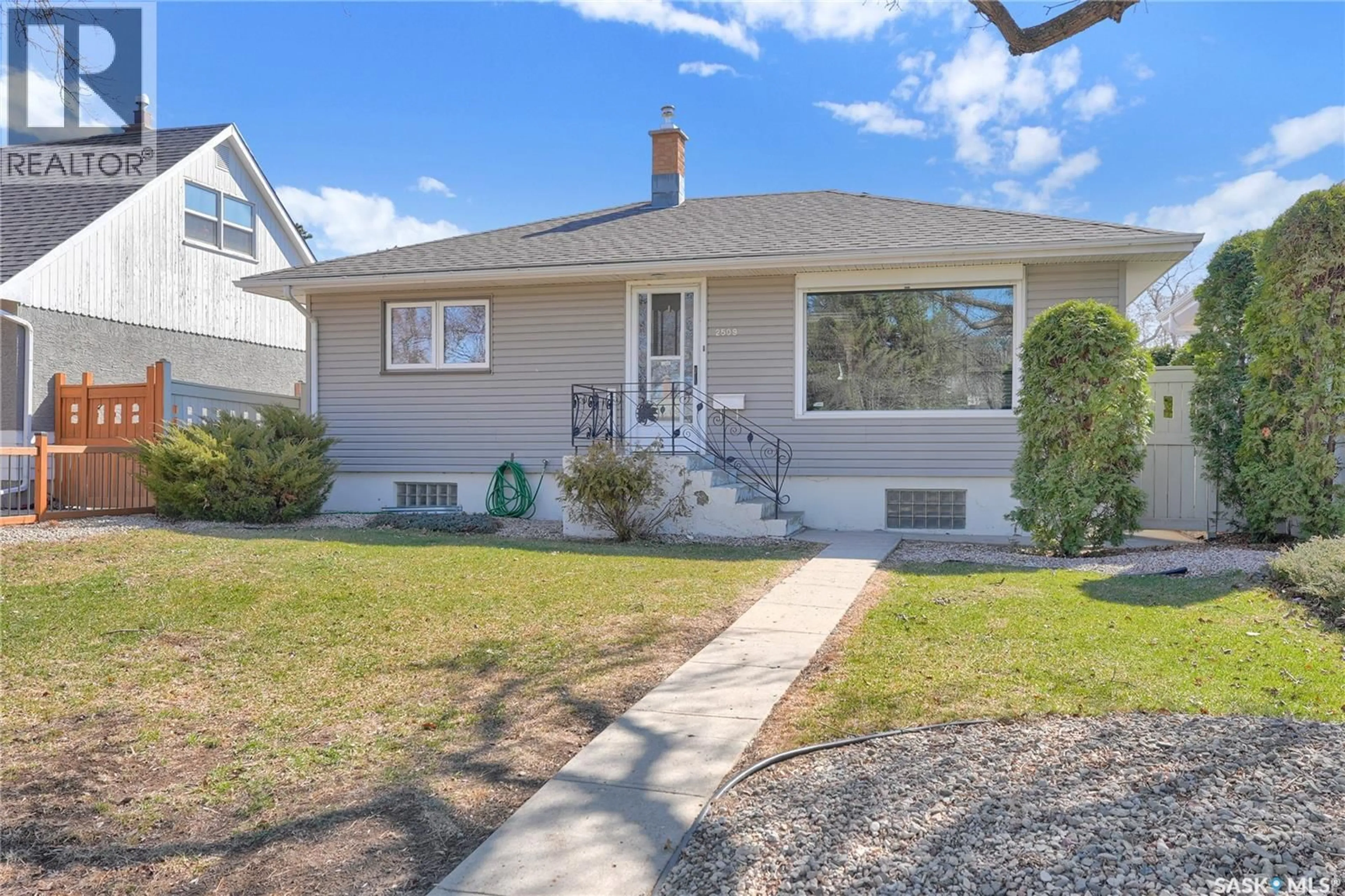 Home with vinyl exterior material, street for 2509 PASQUA STREET, Regina Saskatchewan S4S0M3