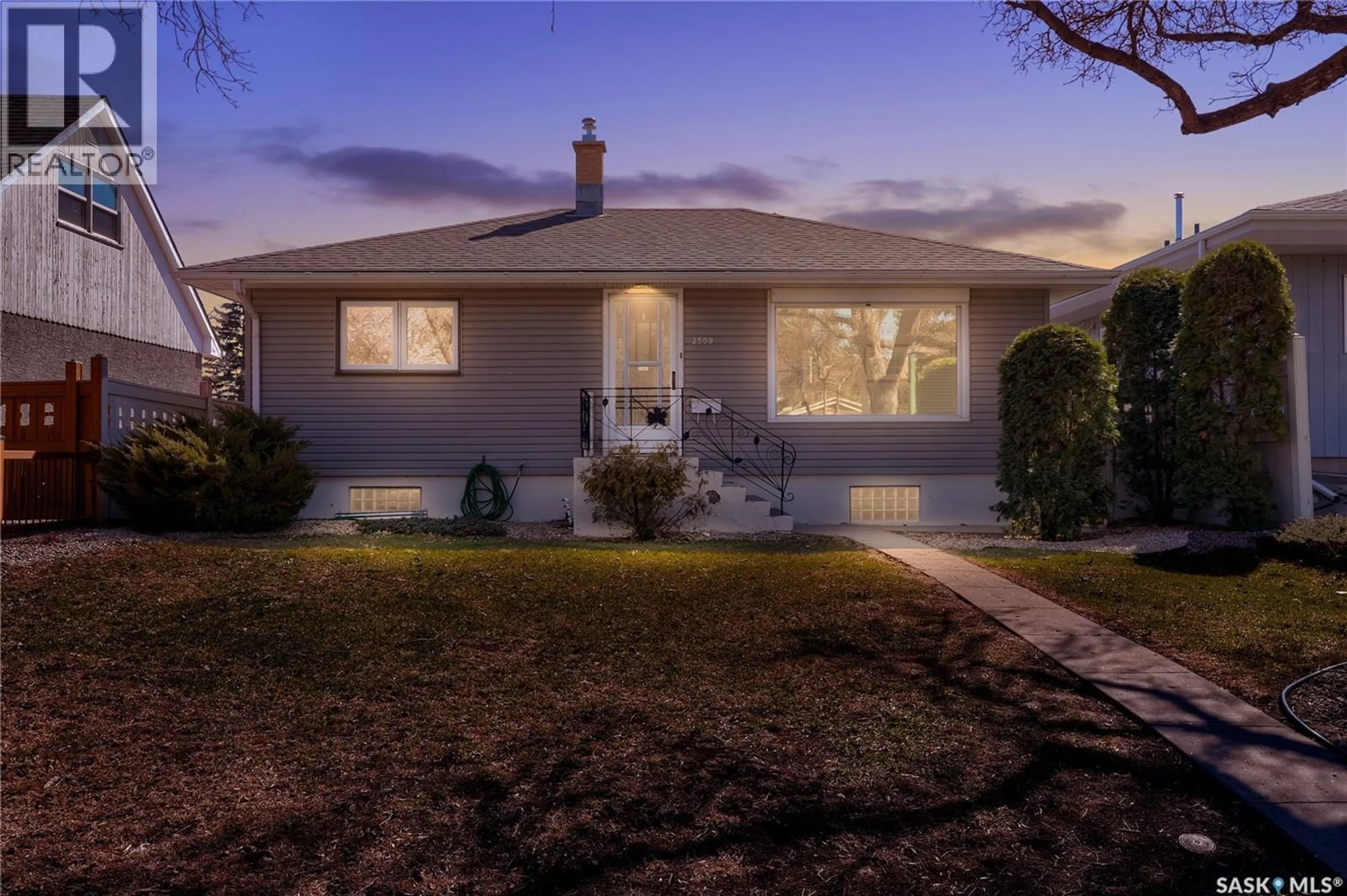 Home with vinyl exterior material, street for 2509 PASQUA STREET, Regina Saskatchewan S4S0M3