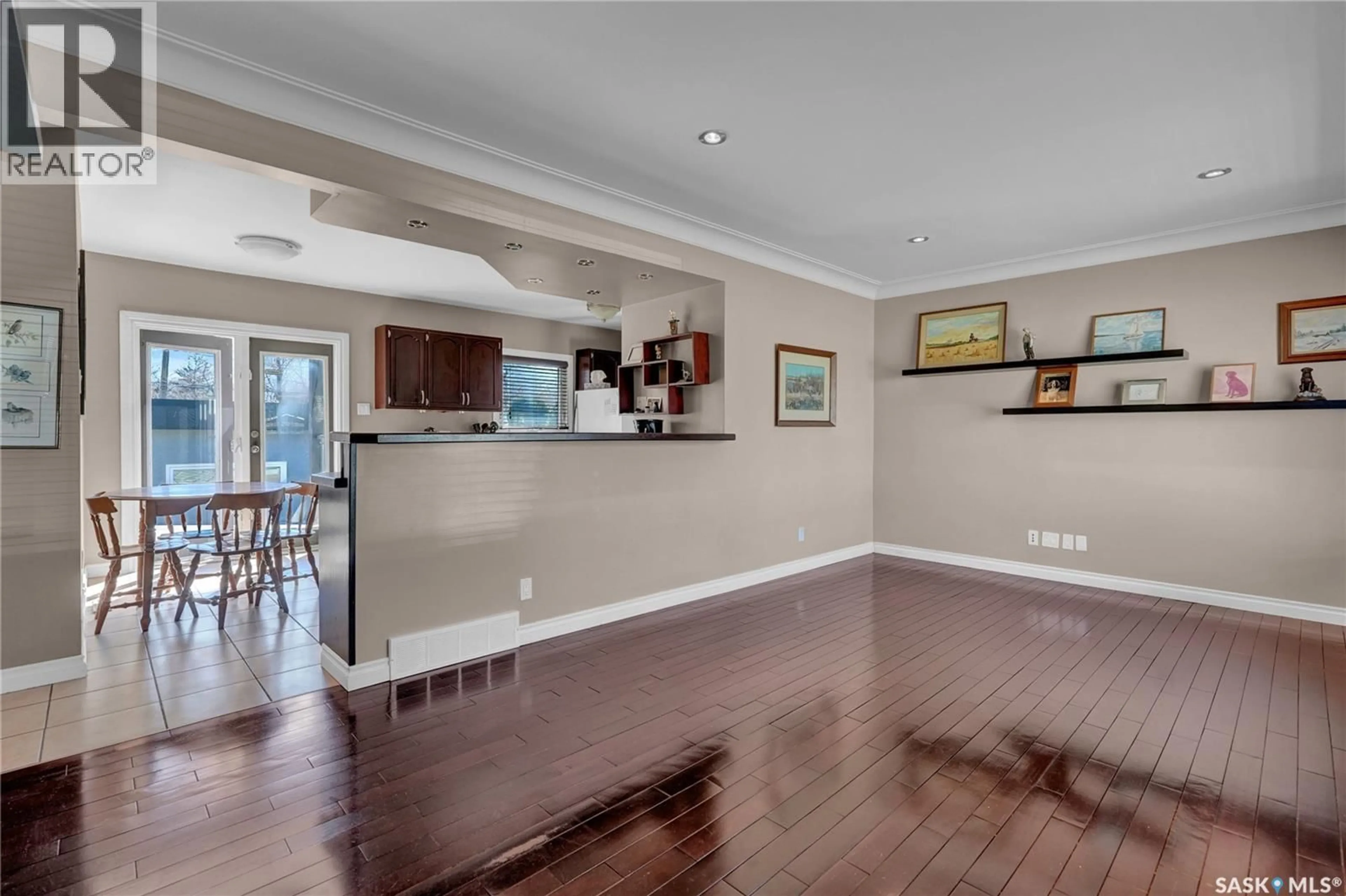 Open concept kitchen, wood/laminate floor for 2509 PASQUA STREET, Regina Saskatchewan S4S0M3