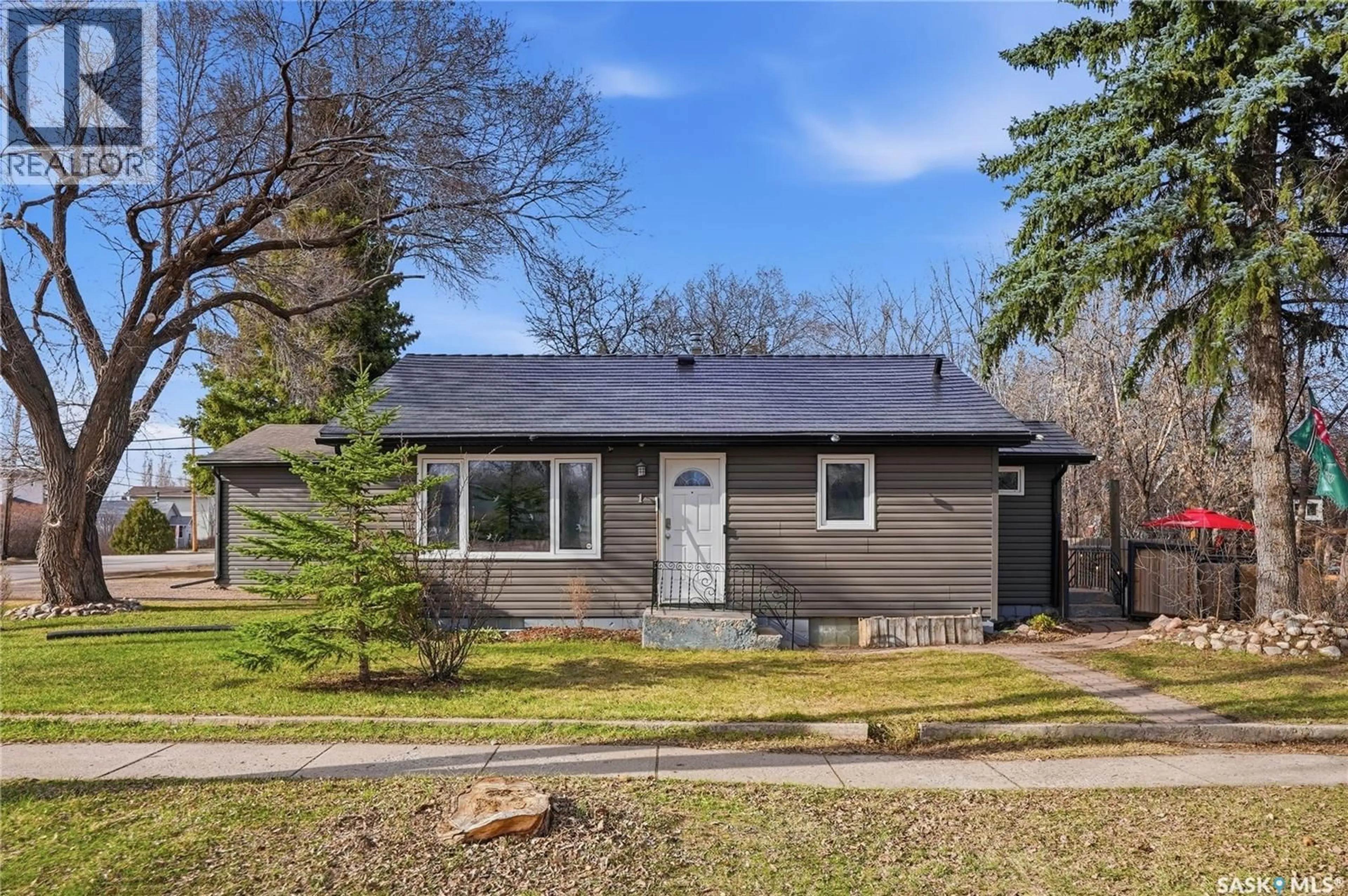 Home with vinyl exterior material, street for 1 2ND STREET, Langham Saskatchewan S0K2L0
