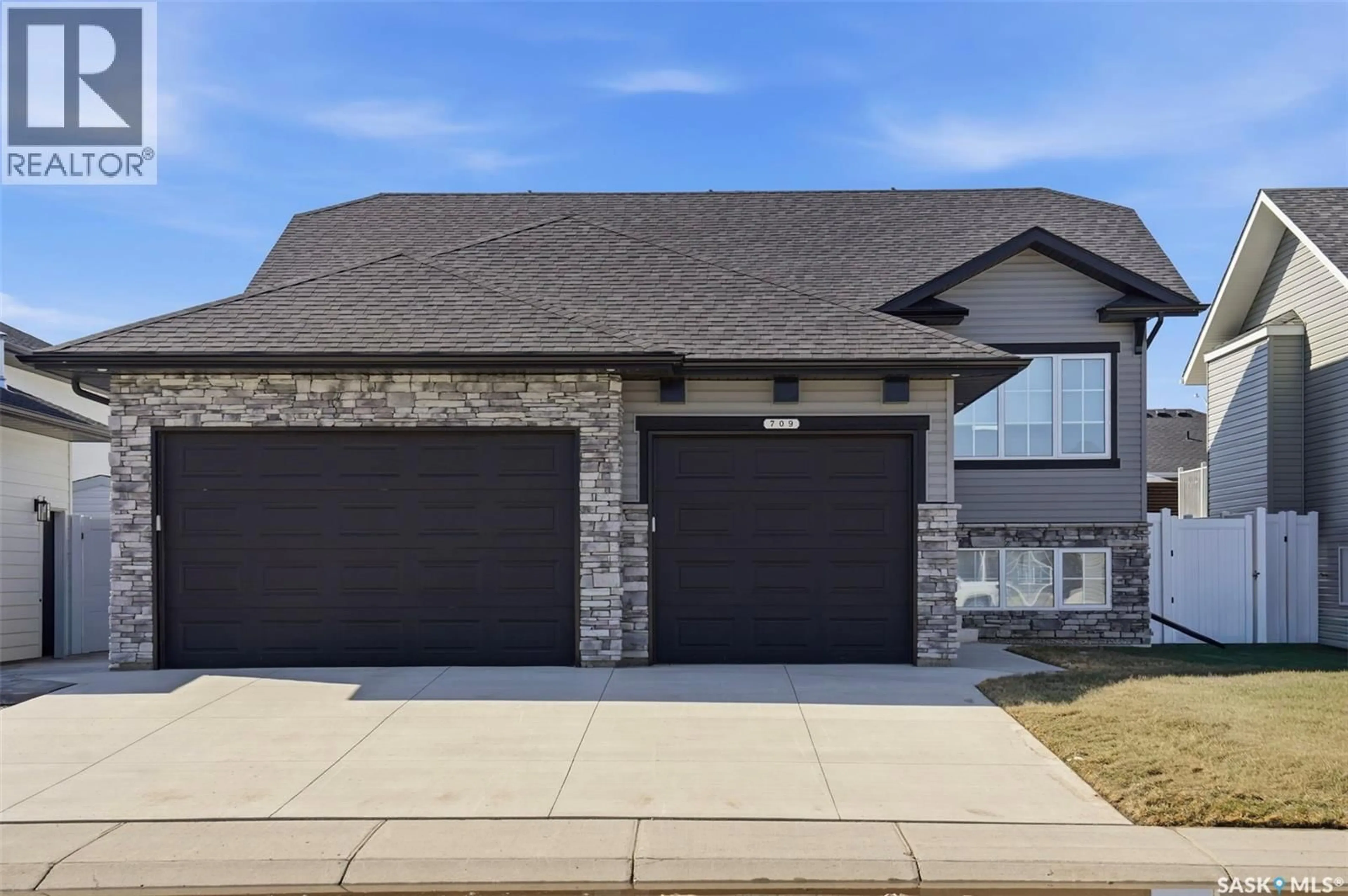 Home with brick exterior material, street for 709 SARAZEN DRIVE, Warman Saskatchewan S0K4S4