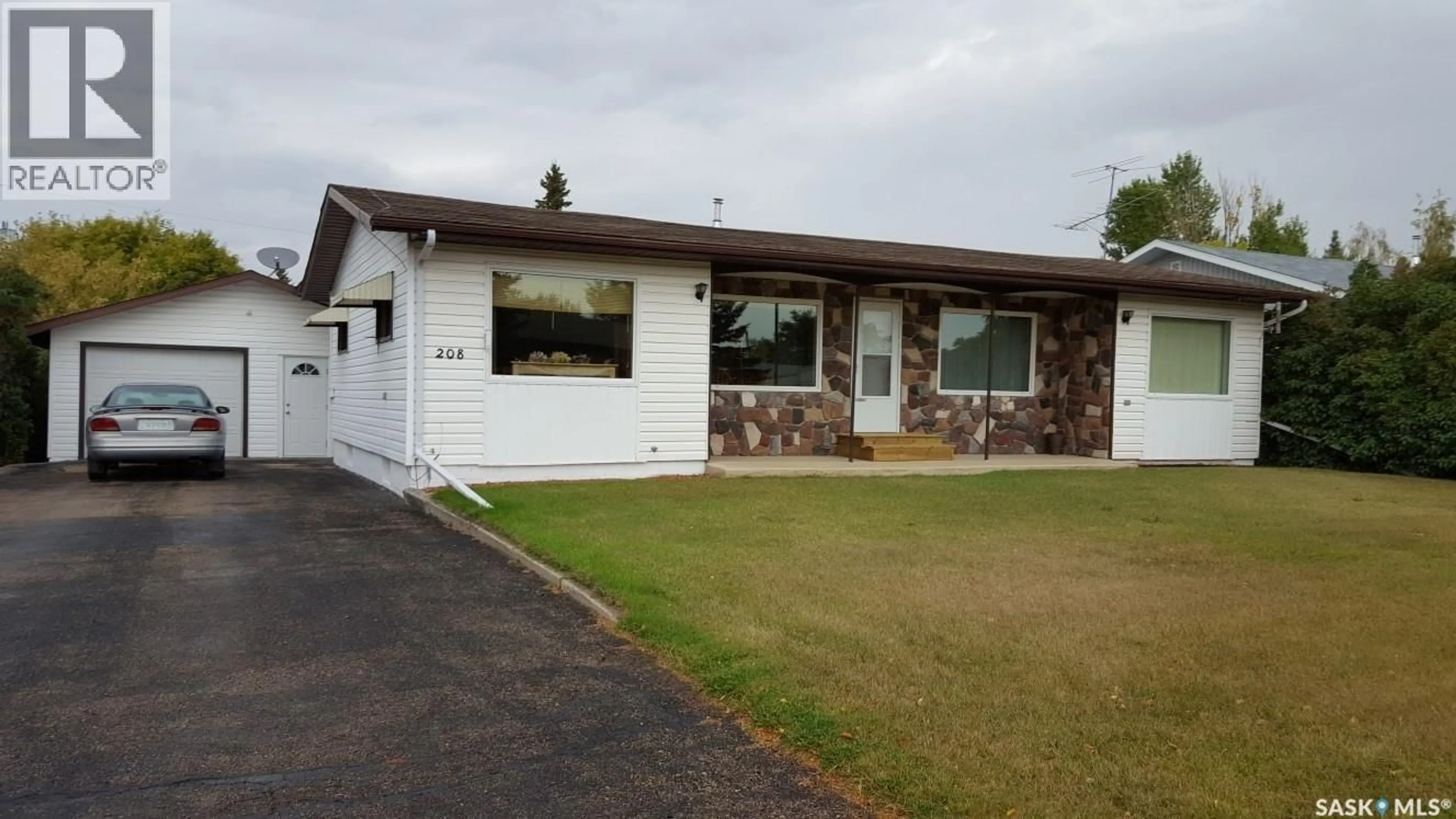 Home with vinyl exterior material, street for 208 5TH STREET, Wakaw Saskatchewan S0K4P0