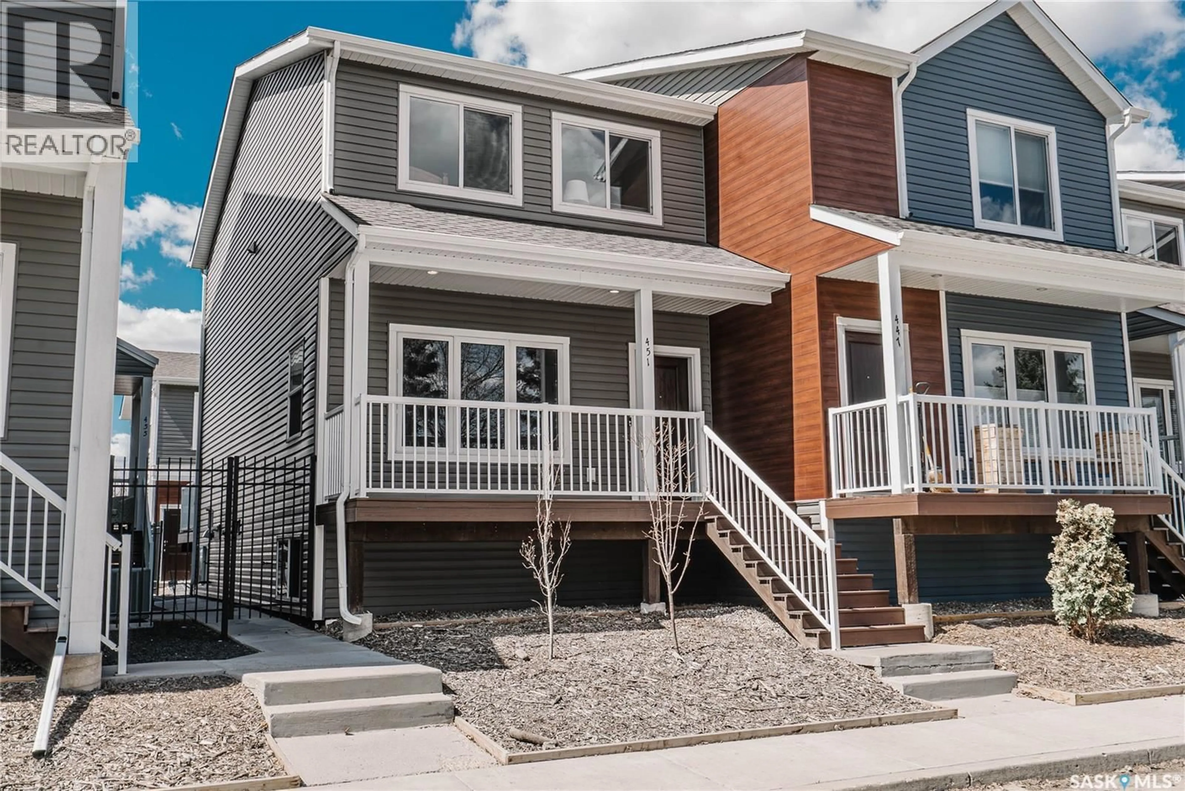 Home with vinyl exterior material, street for 451 L AVENUE, Saskatoon Saskatchewan S7M5Y6