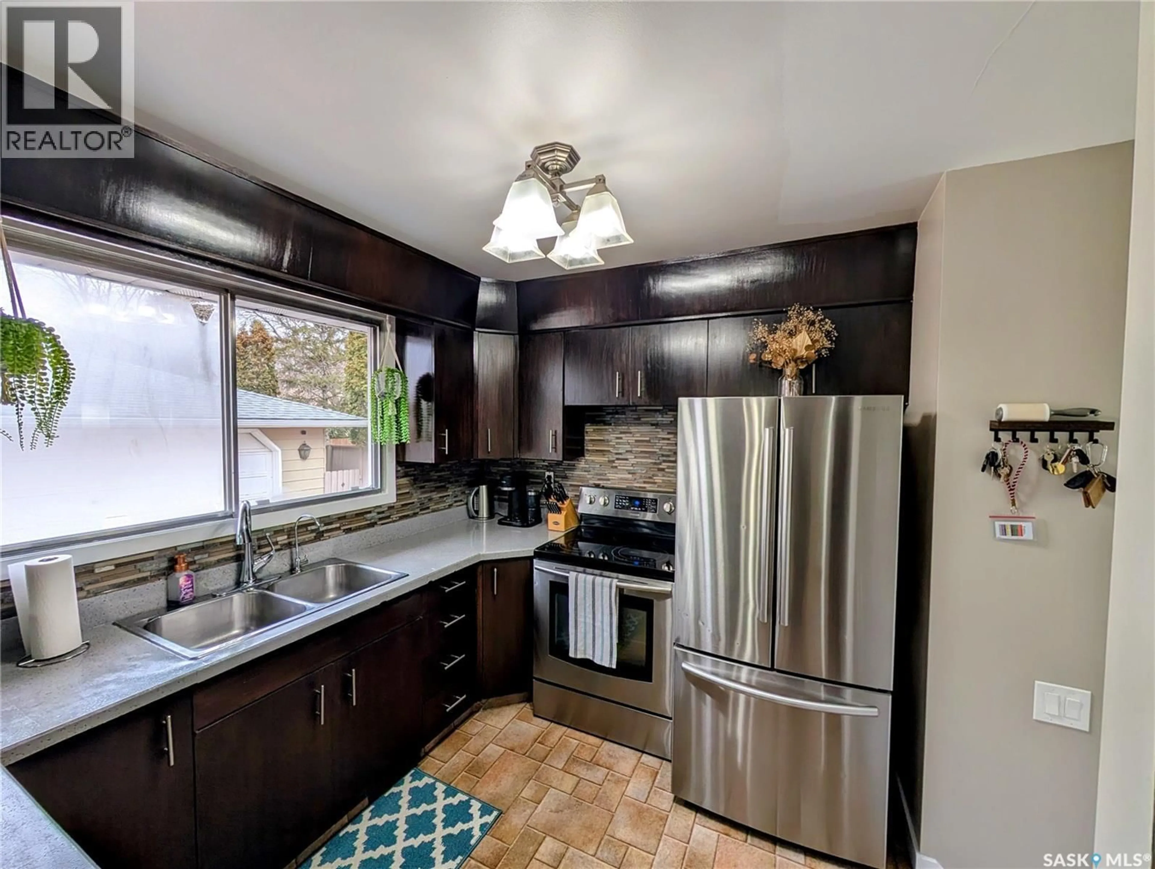 Open concept kitchen, unknown for 24 DRYBURGH CRESCENT, Regina Saskatchewan S4R6R5