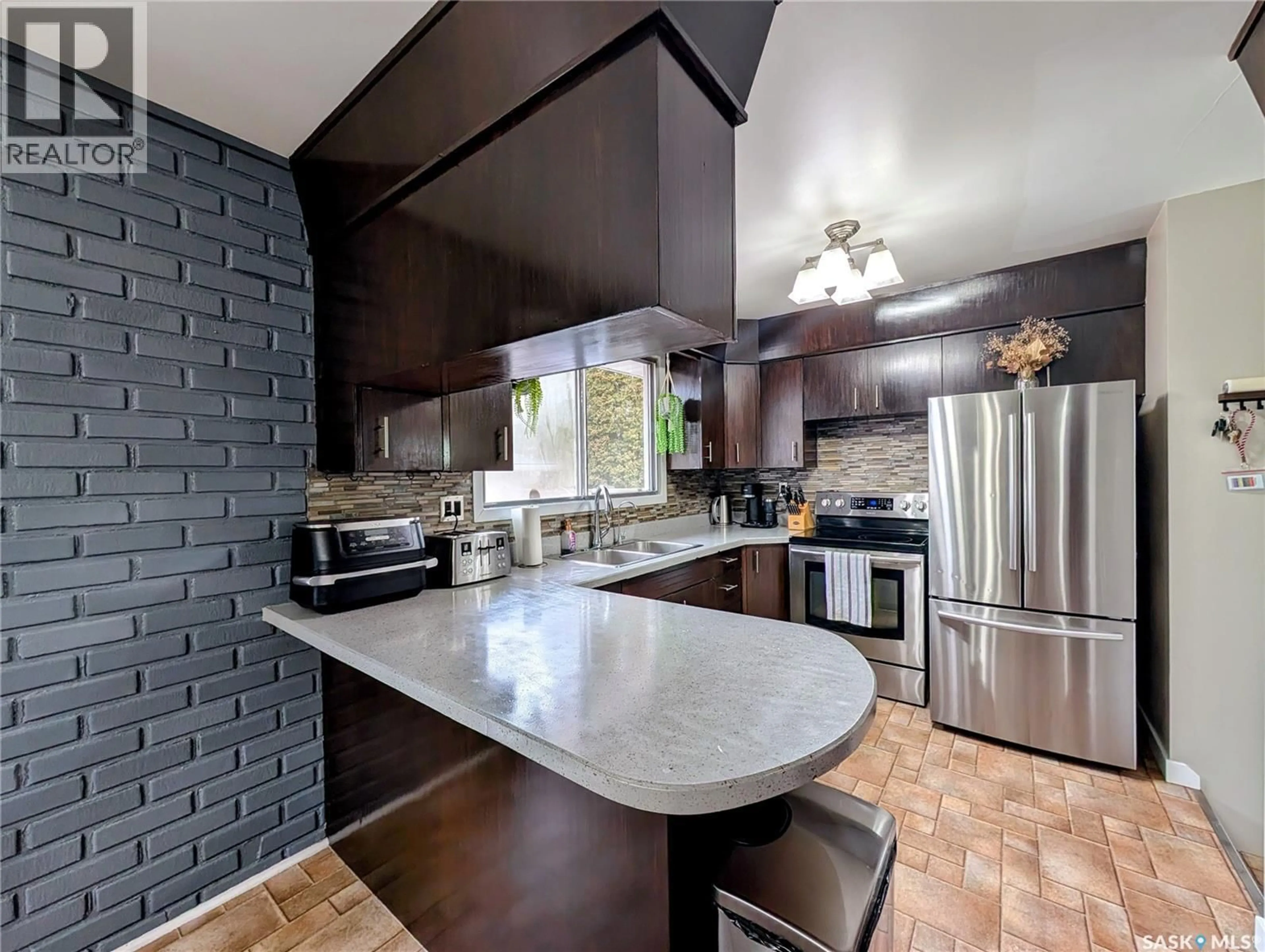 Open concept kitchen, ceramic/tile floor for 24 DRYBURGH CRESCENT, Regina Saskatchewan S4R6R5
