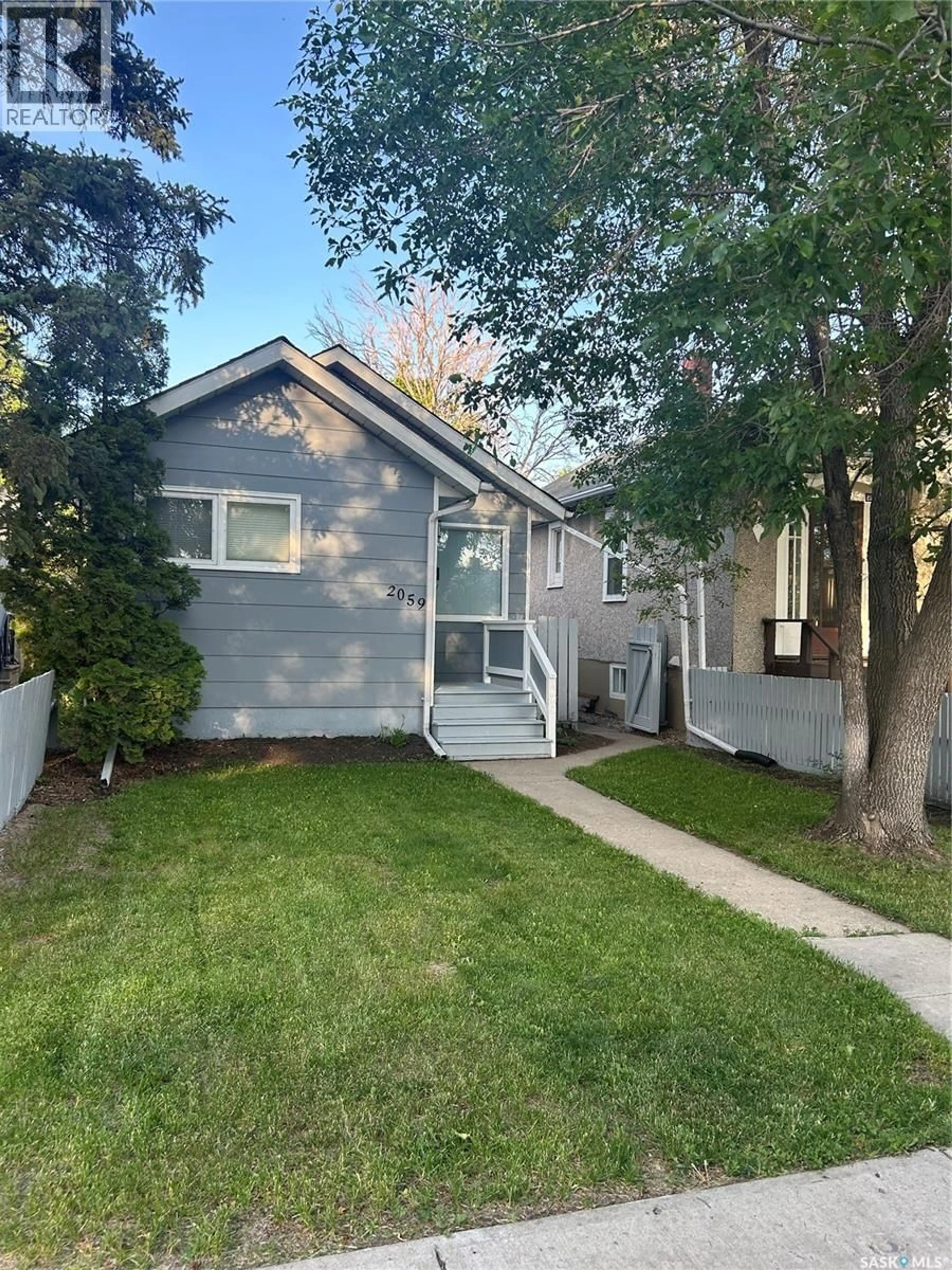 Home with vinyl exterior material, street for 2059 MCDONALD STREET, Regina Saskatchewan S4N2Y4