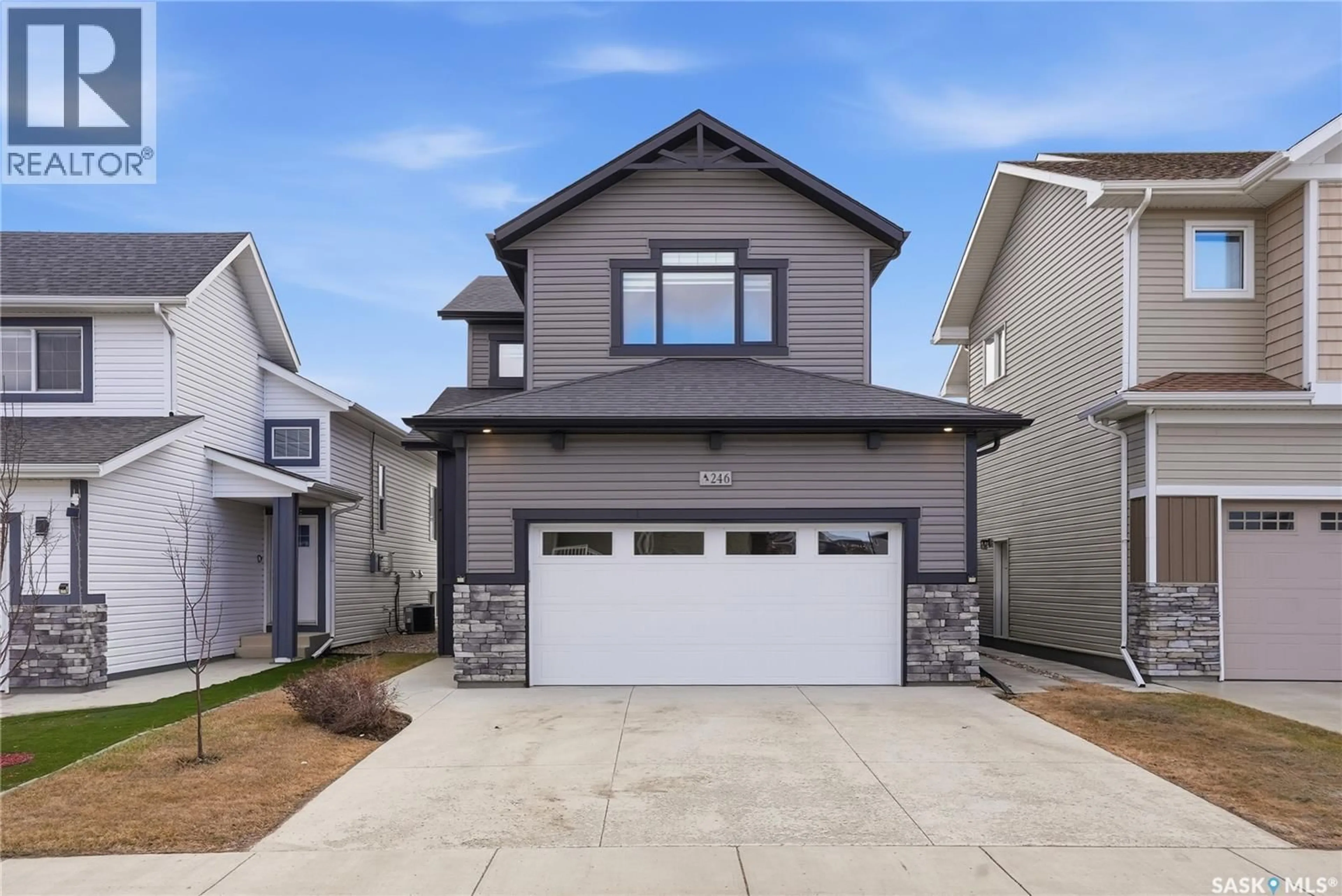 Home with vinyl exterior material, street for 246 ANISKOTAW MANOR, Saskatoon Saskatchewan S7V1L9