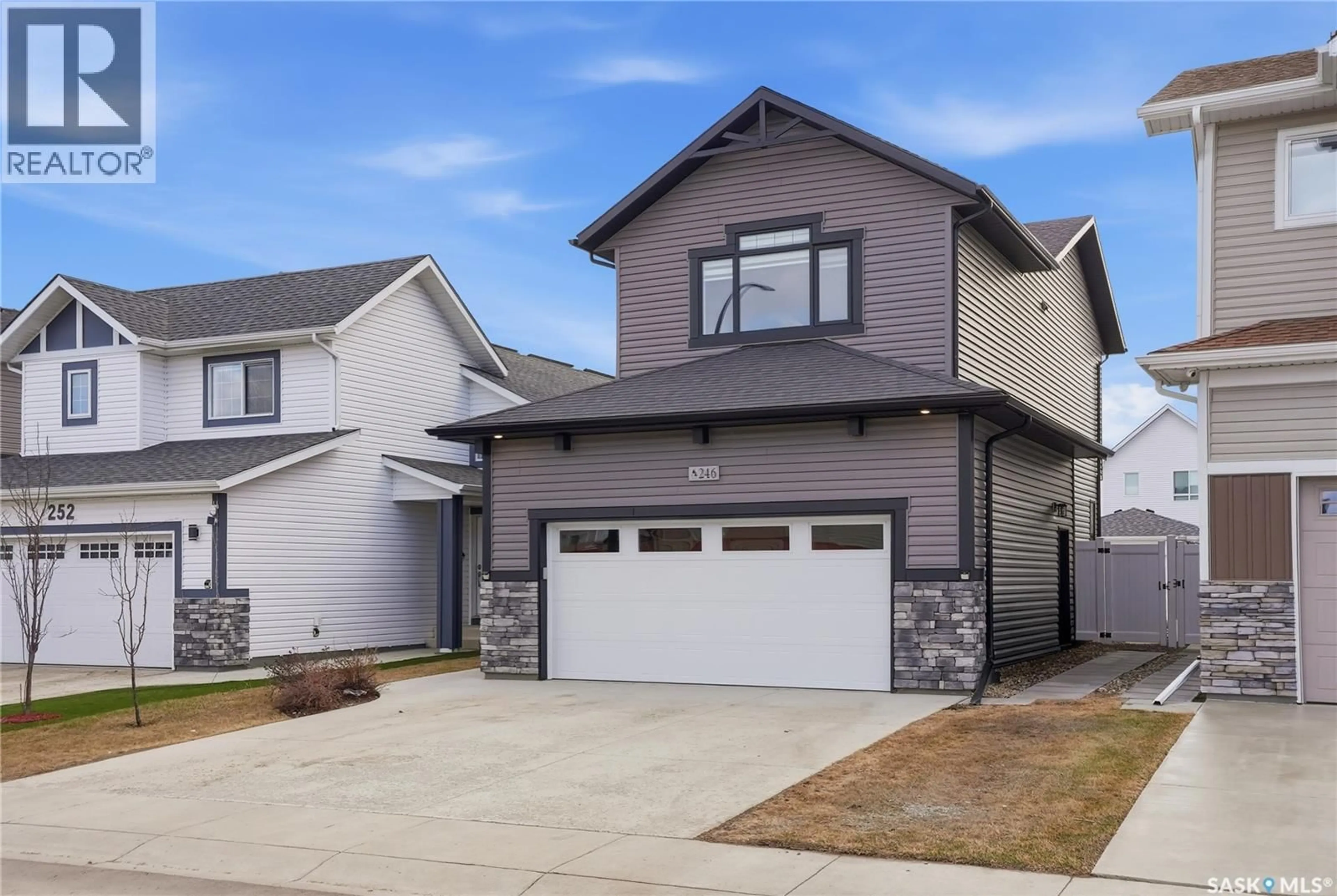 Home with vinyl exterior material, street for 246 ANISKOTAW MANOR, Saskatoon Saskatchewan S7V1L9