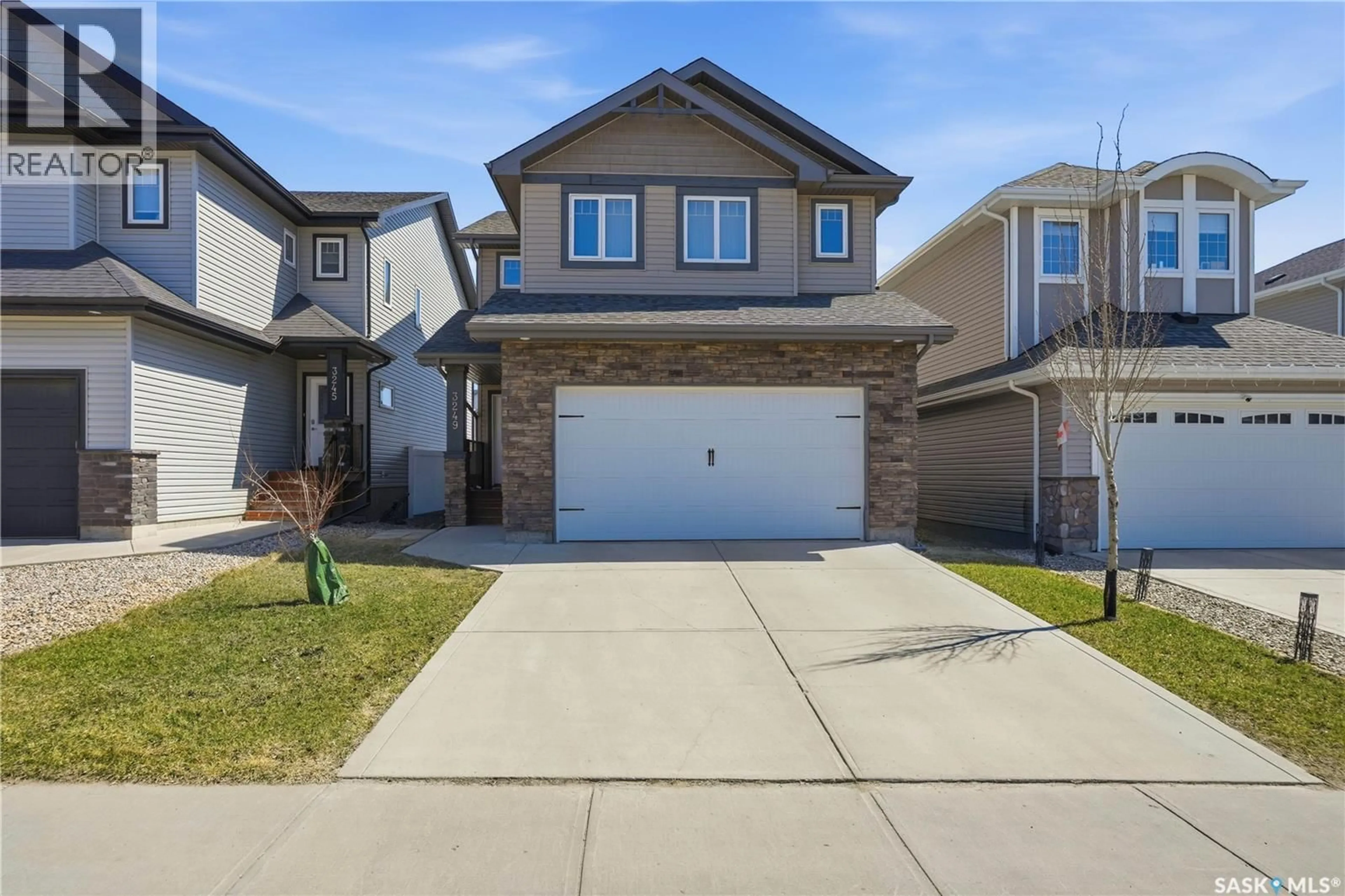 Home with vinyl exterior material, street for 3249 GREEN WATER DRIVE, Regina Saskatchewan S4V3R6