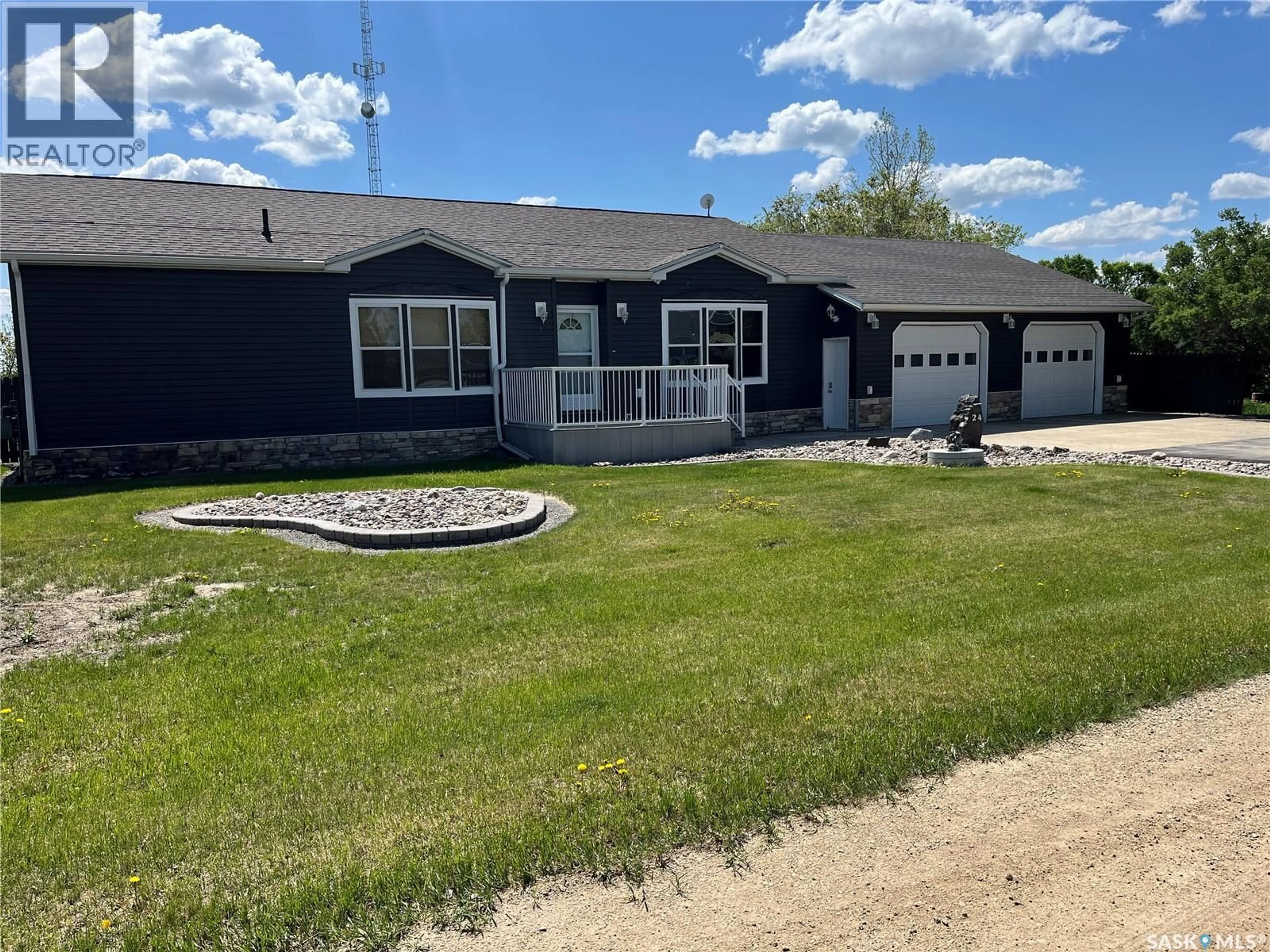 Home with vinyl exterior material, street for 24 HALL STREET, Halbrite Saskatchewan S0C1H0