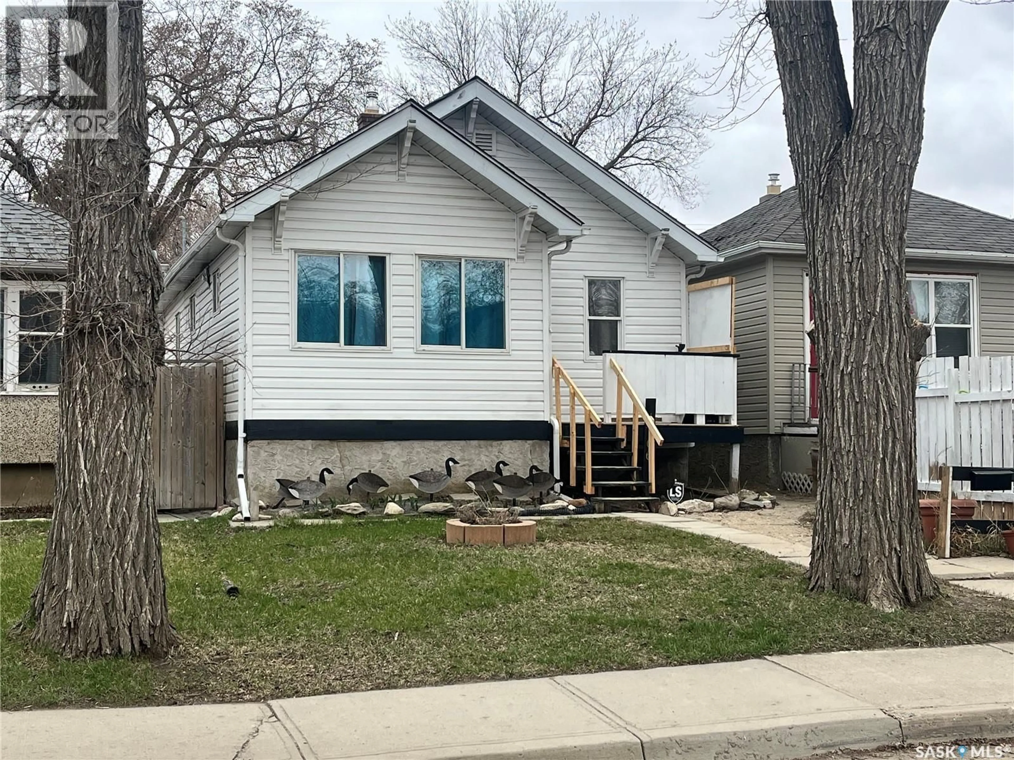 Home with vinyl exterior material, street for 1166 RETALLACK STREET, Regina Saskatchewan S4T2H5