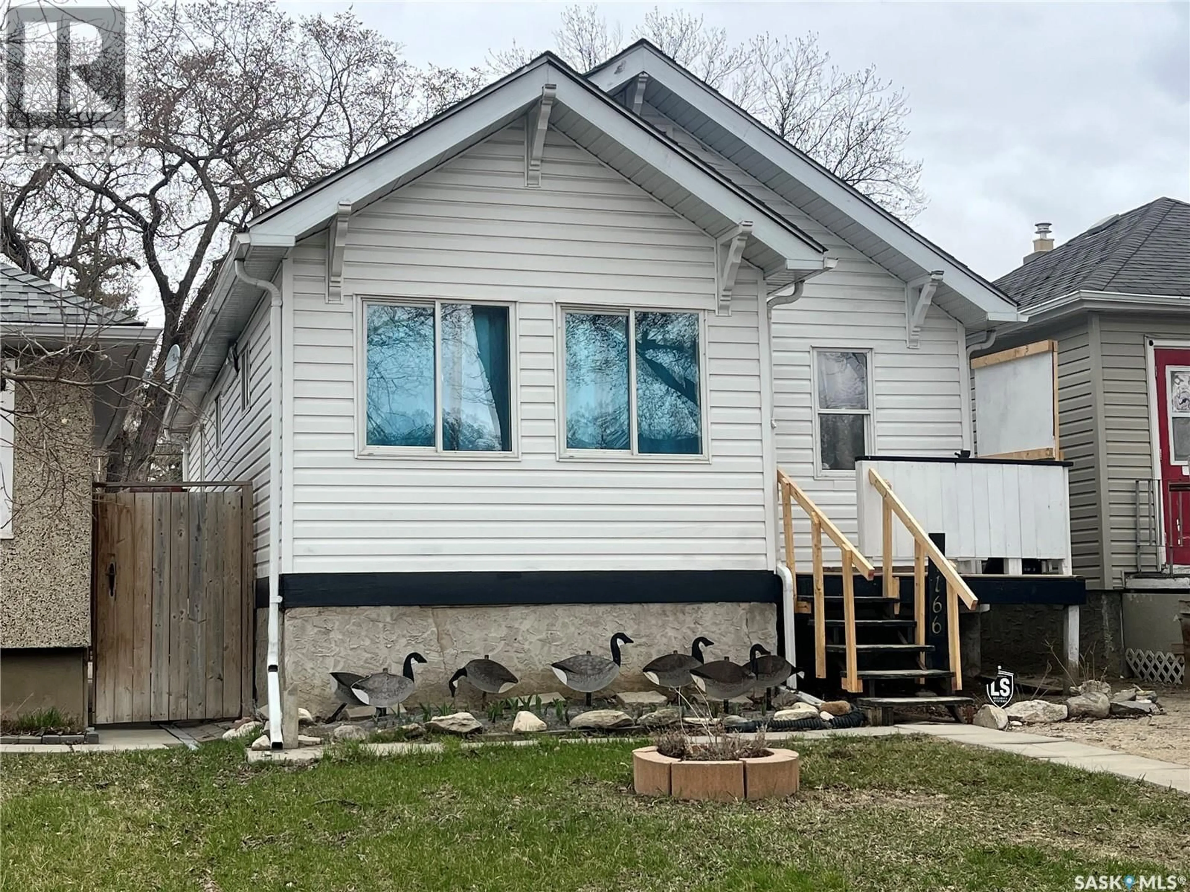 Home with vinyl exterior material, street for 1166 RETALLACK STREET, Regina Saskatchewan S4T2H5