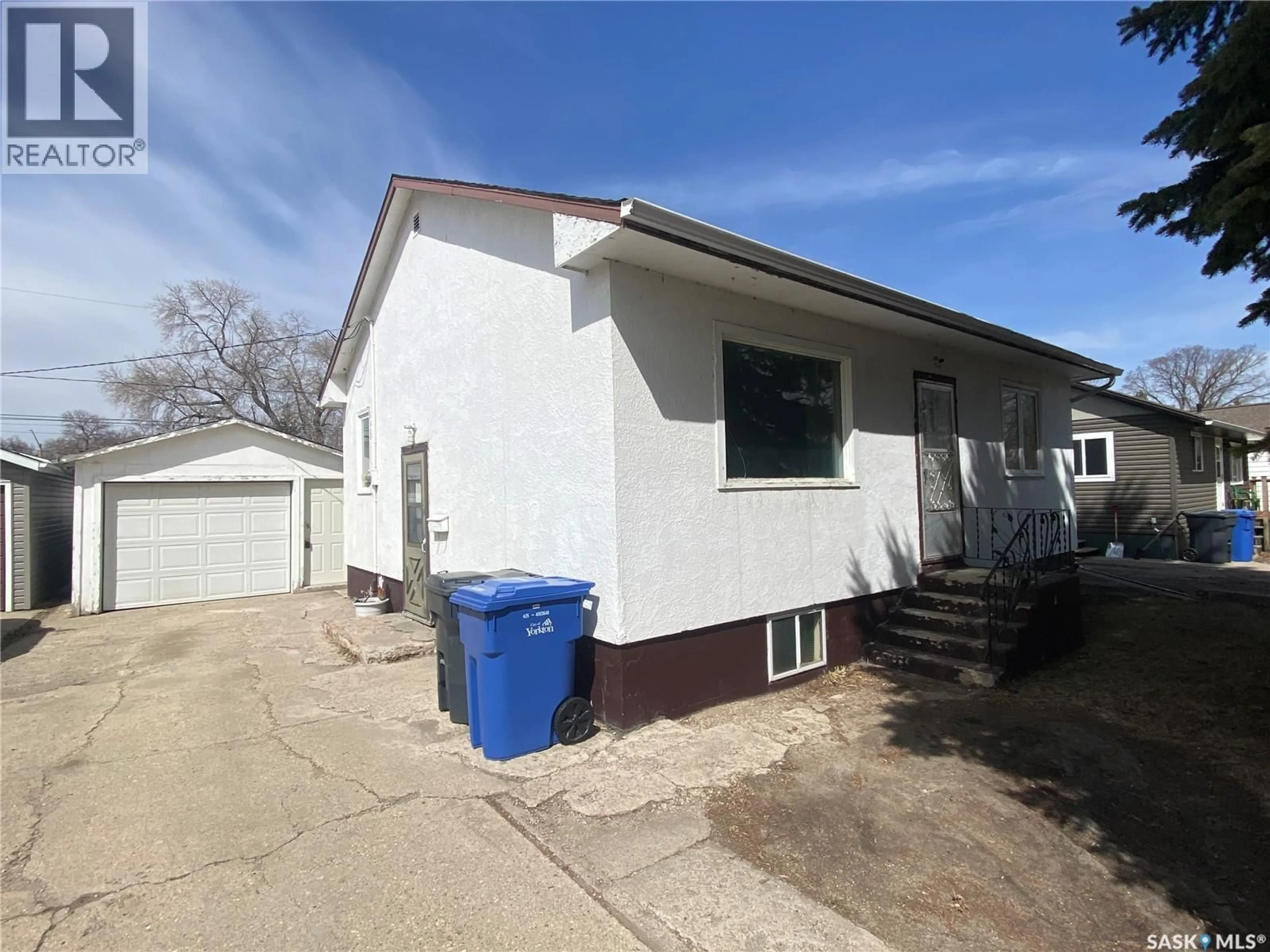 Home with vinyl exterior material, street for 52 MACFARLINE AVENUE, Yorkton Saskatchewan S3N2C6