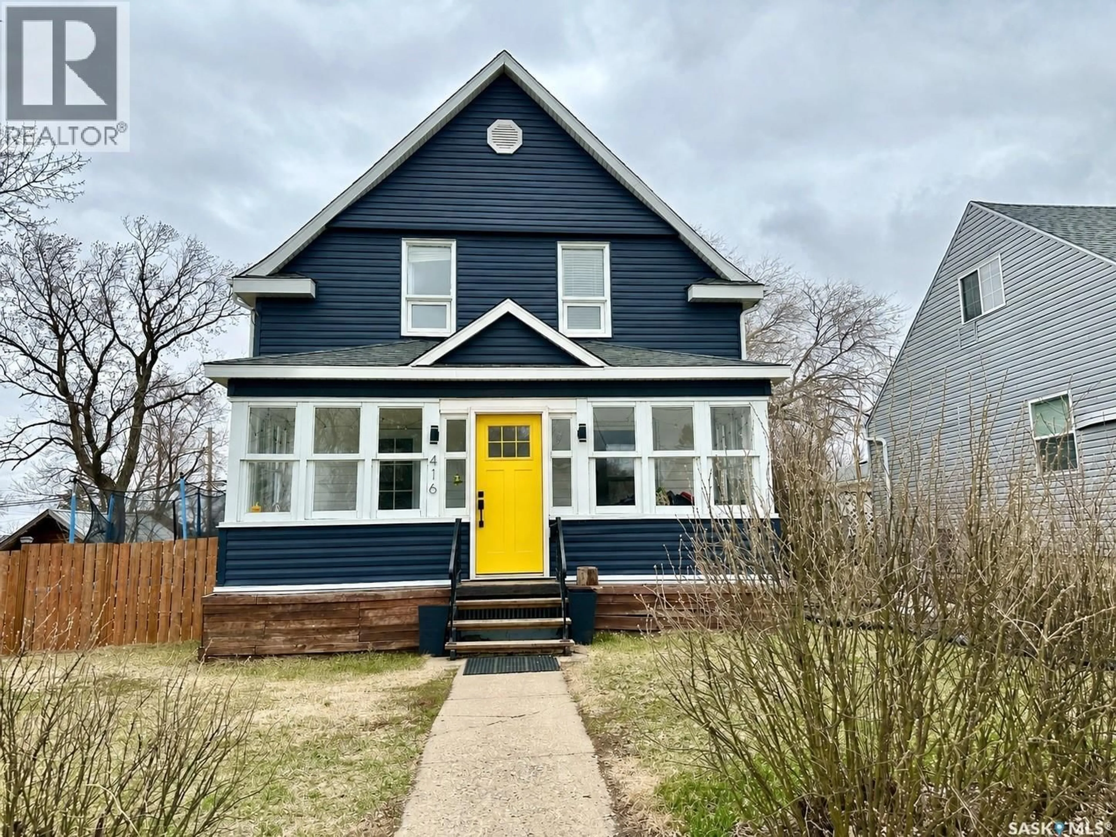 Home with vinyl exterior material, street for 416 3RD STREET, Weyburn Saskatchewan S4H2C8