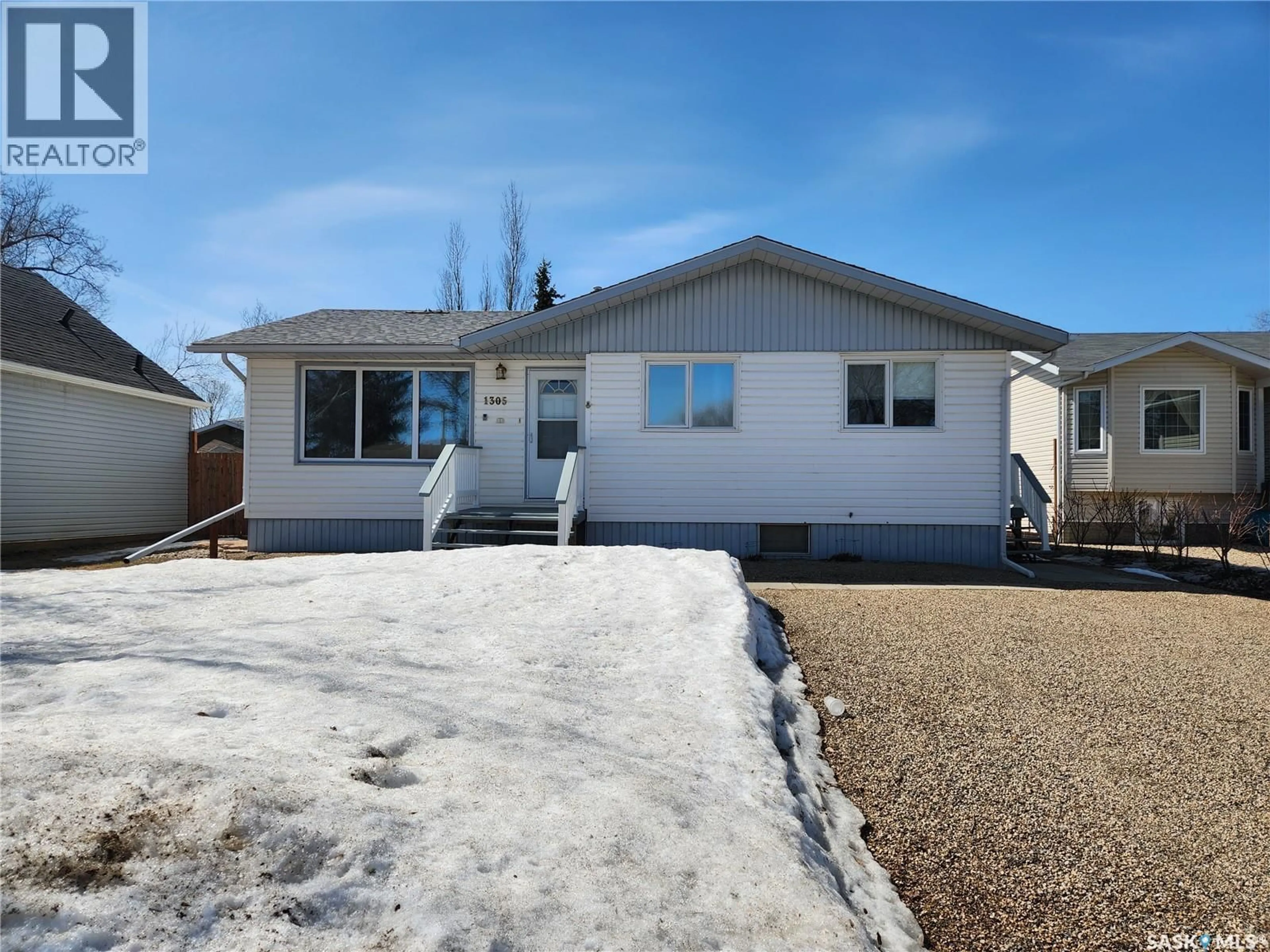 Home with vinyl exterior material, street for 1305 95TH STREET, Tisdale Saskatchewan S0E1T0