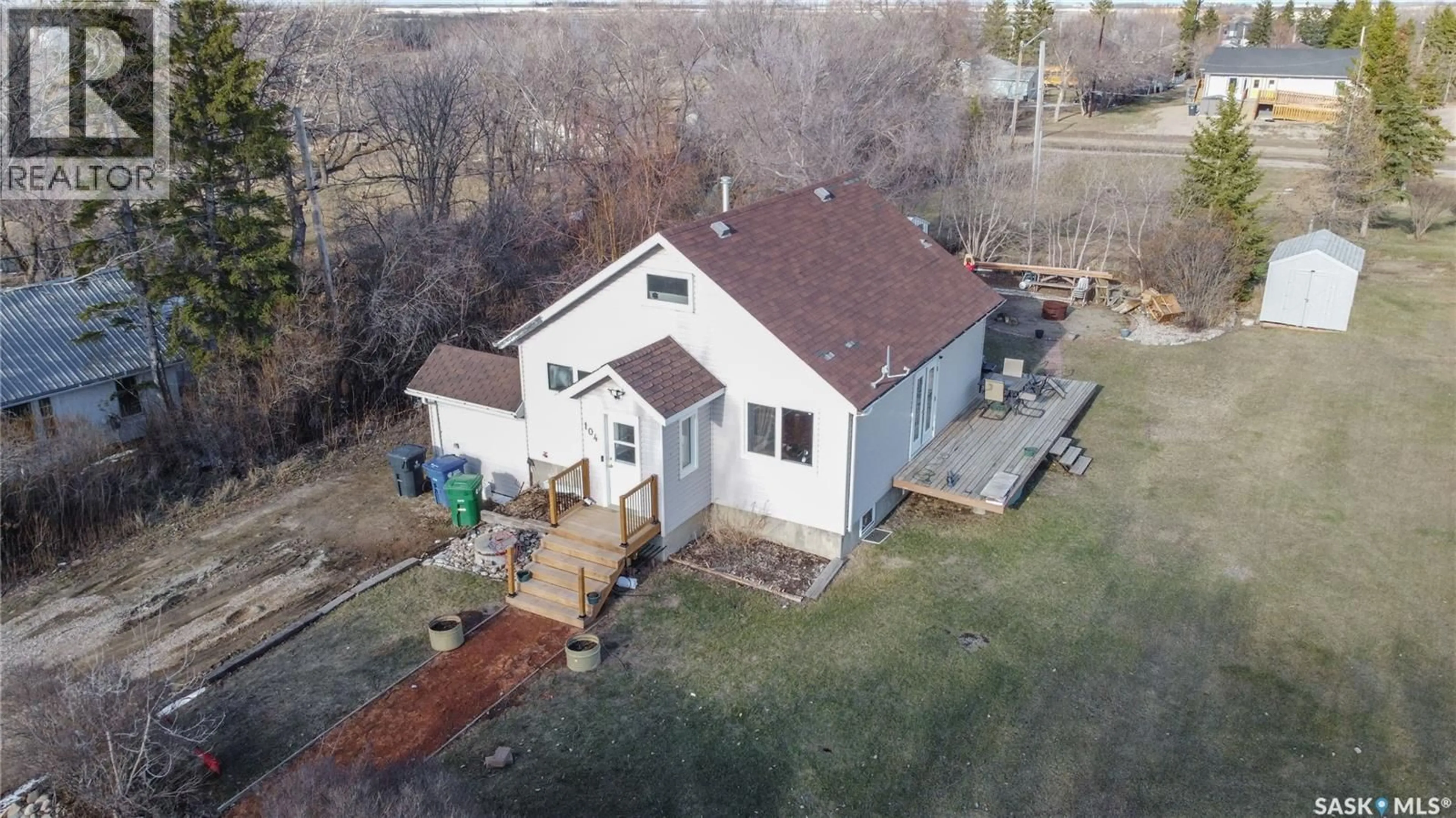 A pic from outside/outdoor area/front of a property/back of a property/a pic from drone, building for 104 BREWER STREET, Edenwold Saskatchewan S0G1K0