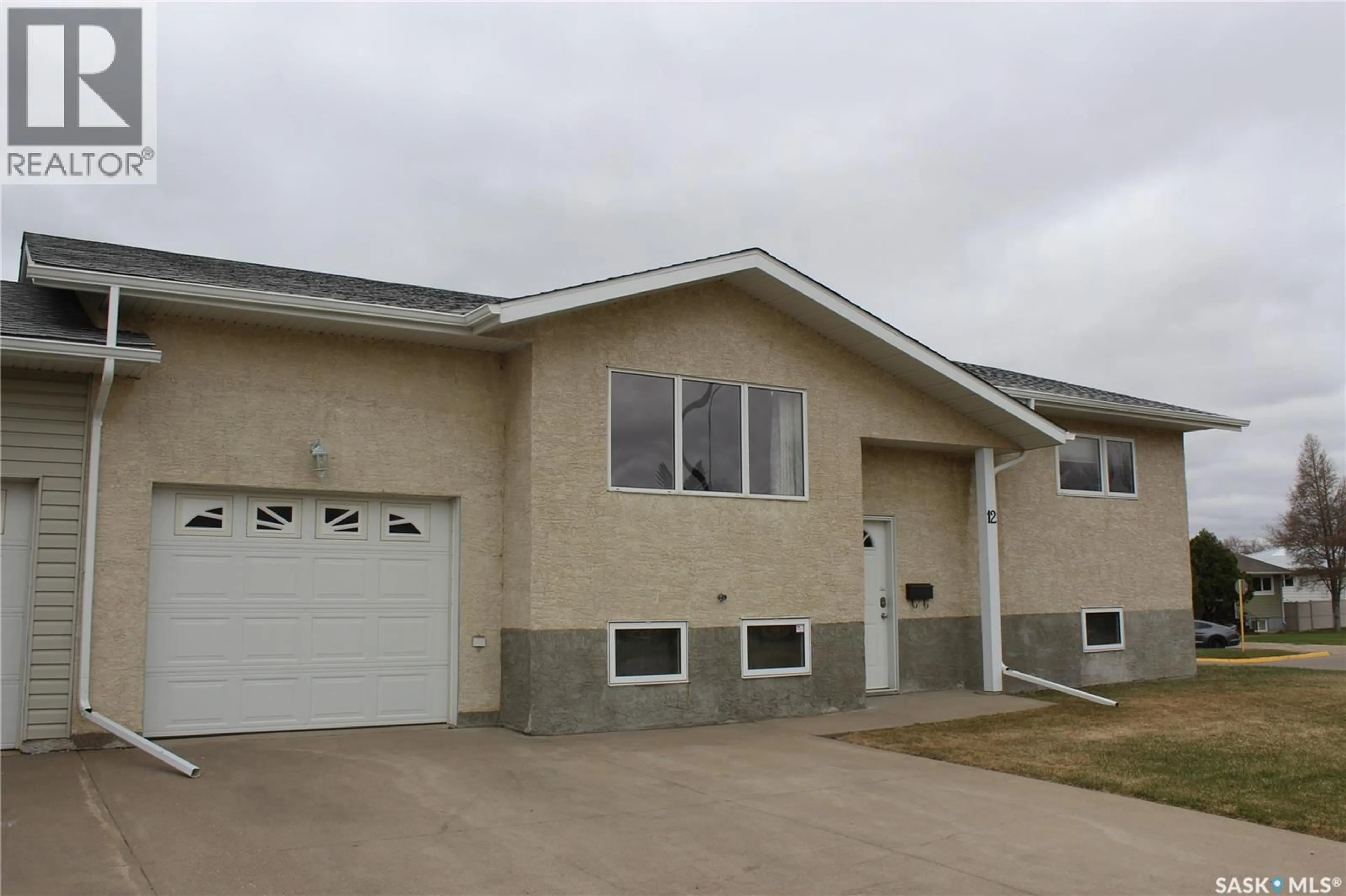 Home with vinyl exterior material, street for 12 491 BANNATYNE AVENUE, Estevan Saskatchewan S4A2X3