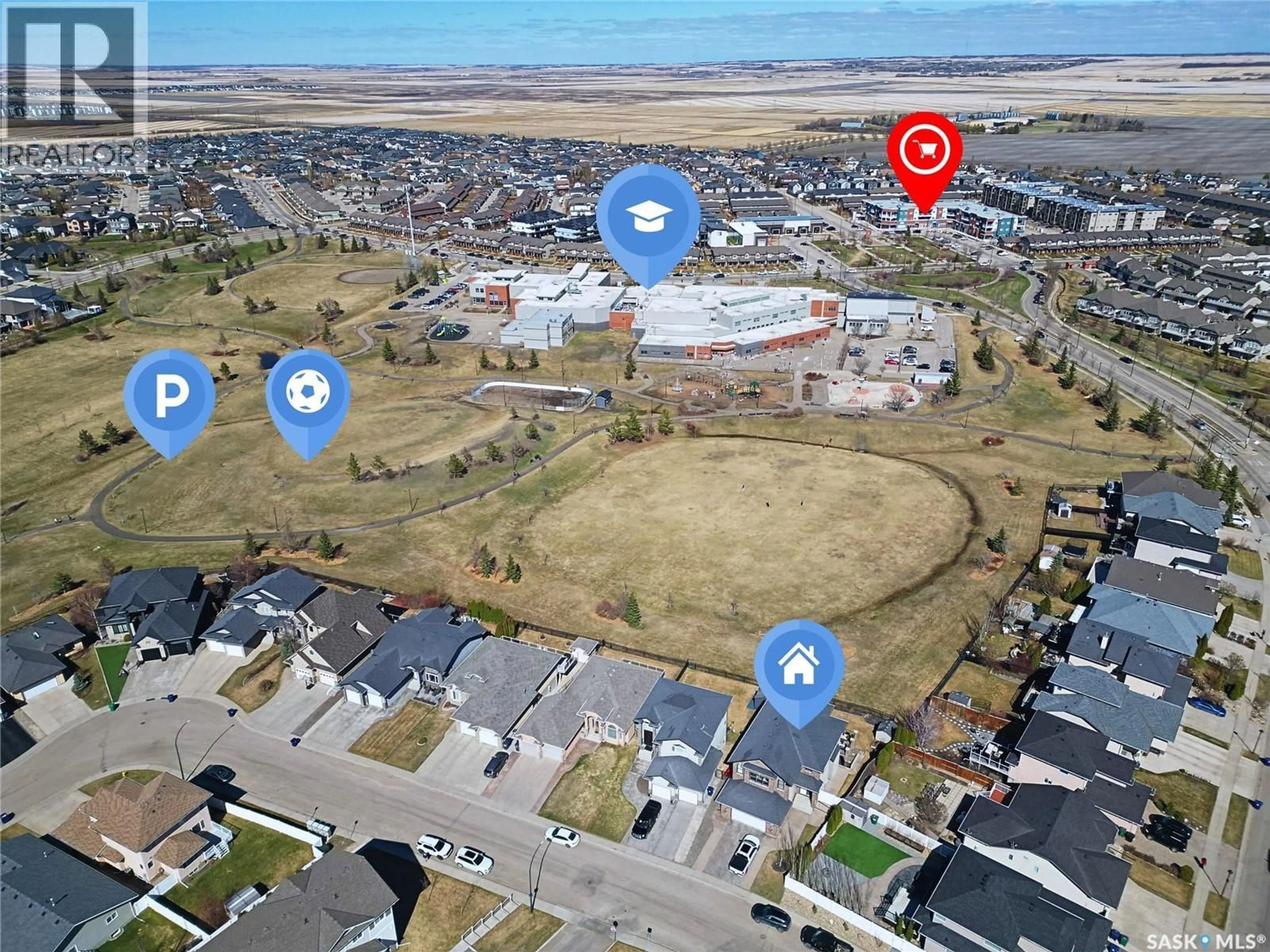 A pic from outside/outdoor area/front of a property/back of a property/a pic from drone, street for 102 THODE AVENUE, Saskatoon Saskatchewan S7W1A1