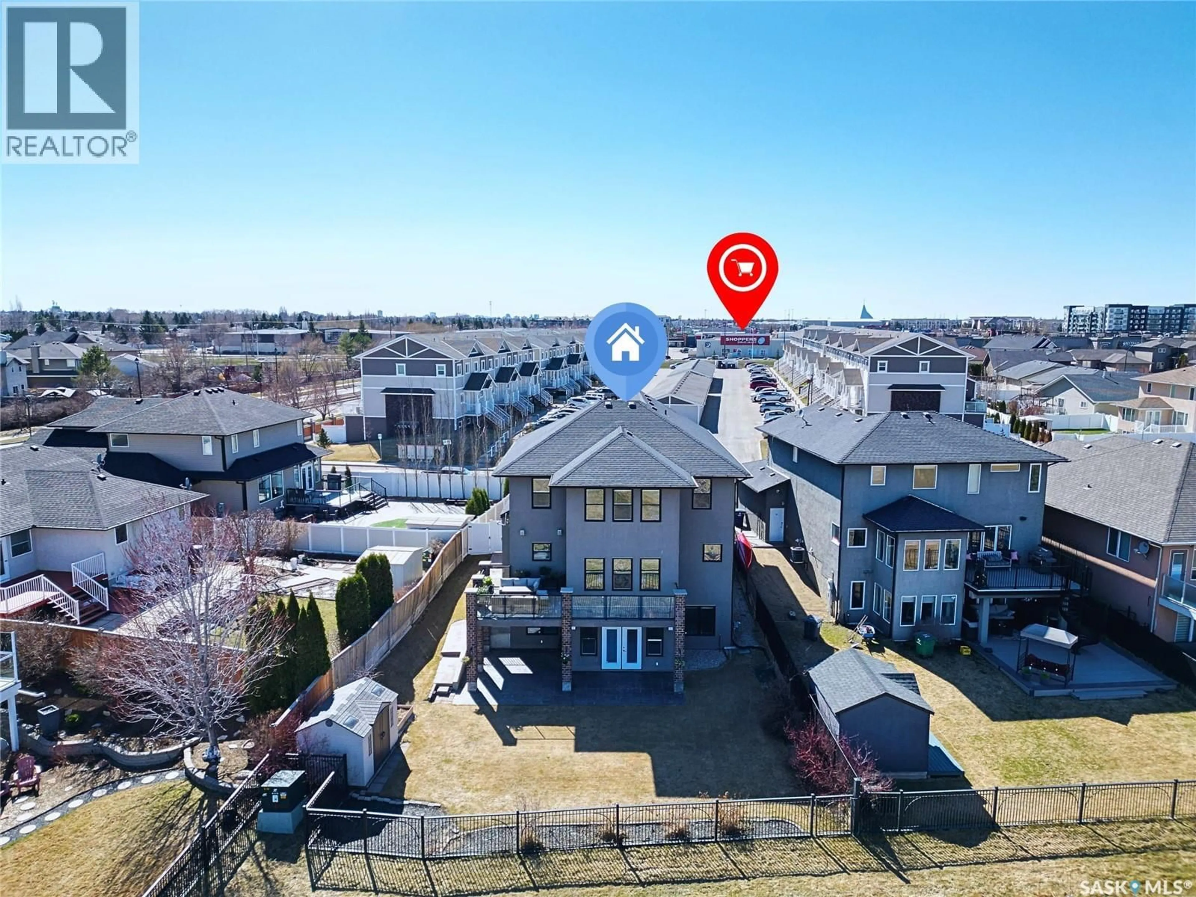 A pic from outside/outdoor area/front of a property/back of a property/a pic from drone, unknown for 102 THODE AVENUE, Saskatoon Saskatchewan S7W1A1