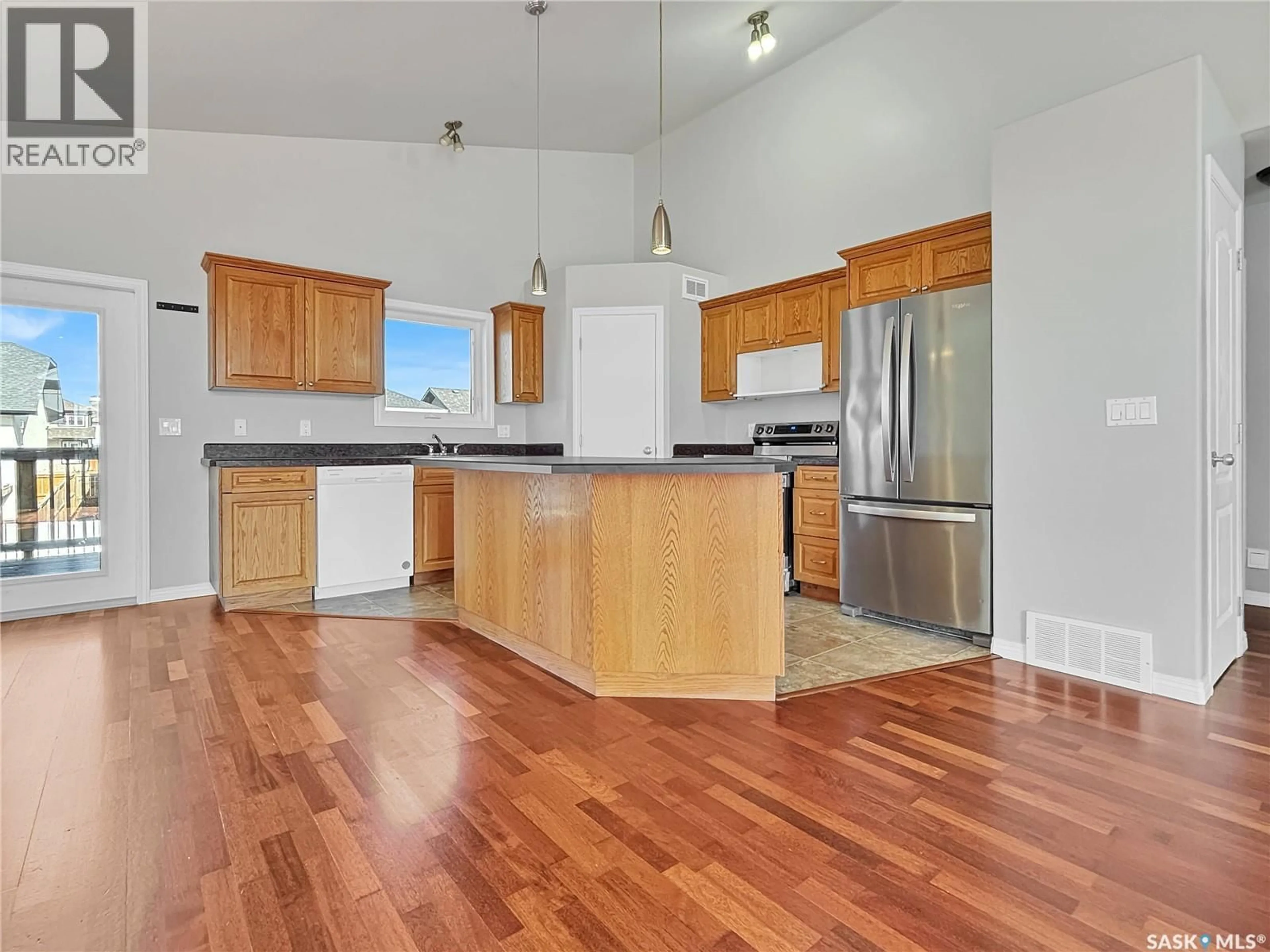 Open concept kitchen, wood/laminate floor for 143 ALLWOOD CRESCENT, Saskatoon Saskatchewan S7R0A3