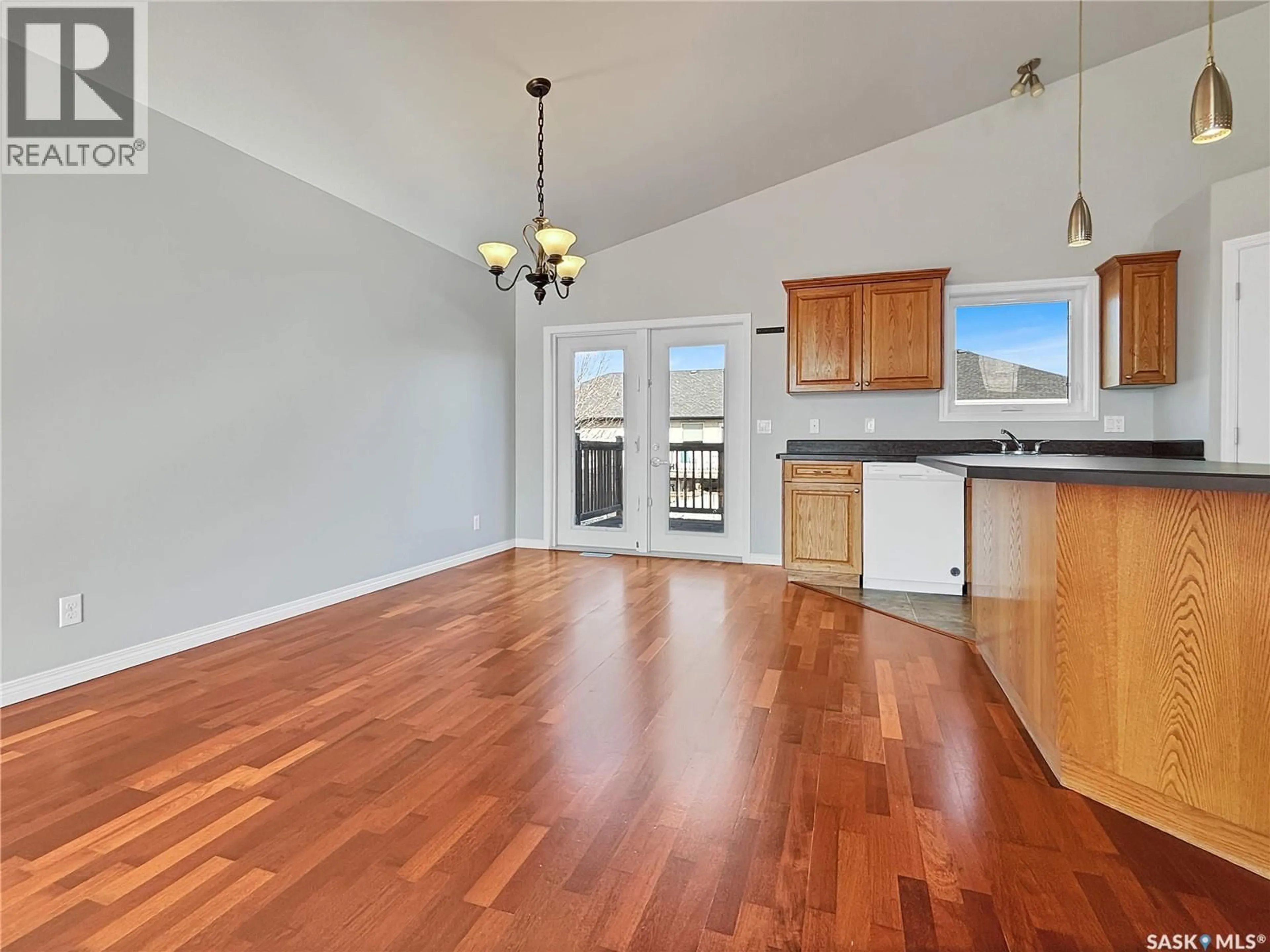 Open concept kitchen, wood/laminate floor for 143 ALLWOOD CRESCENT, Saskatoon Saskatchewan S7R0A3