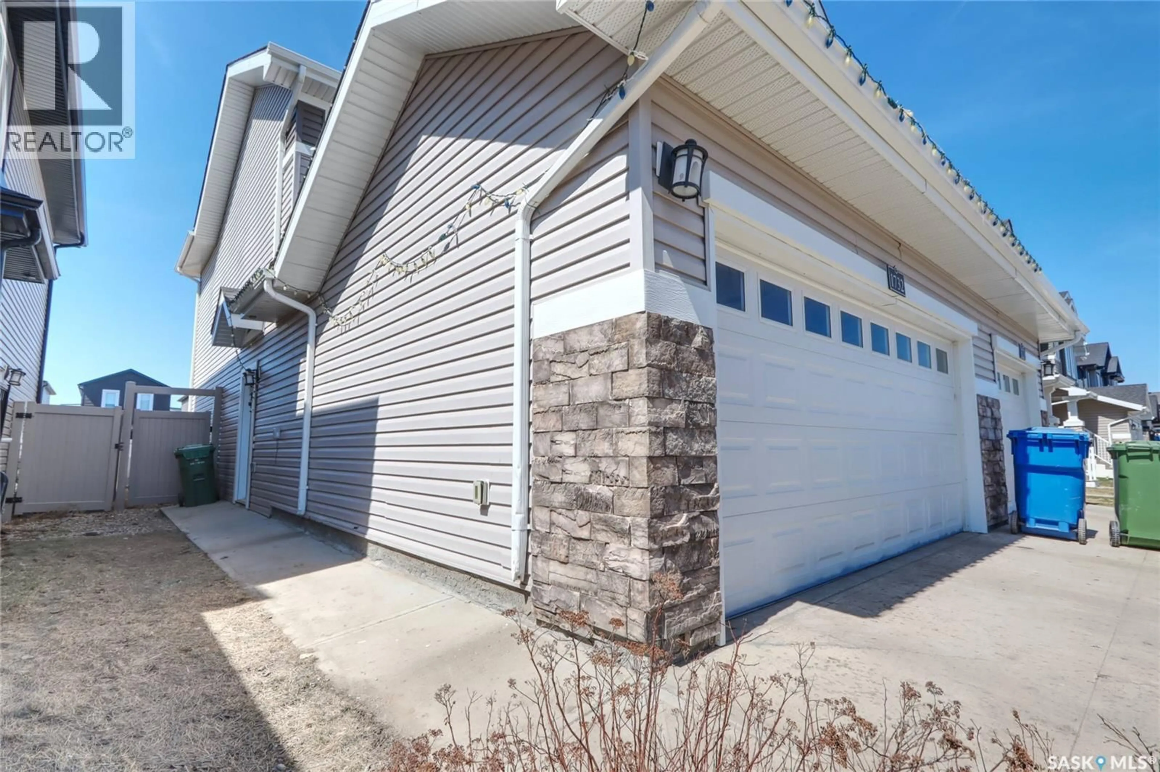 Home with vinyl exterior material, street for 1732 MUSTARD STREET, Regina Saskatchewan S4Y0G1