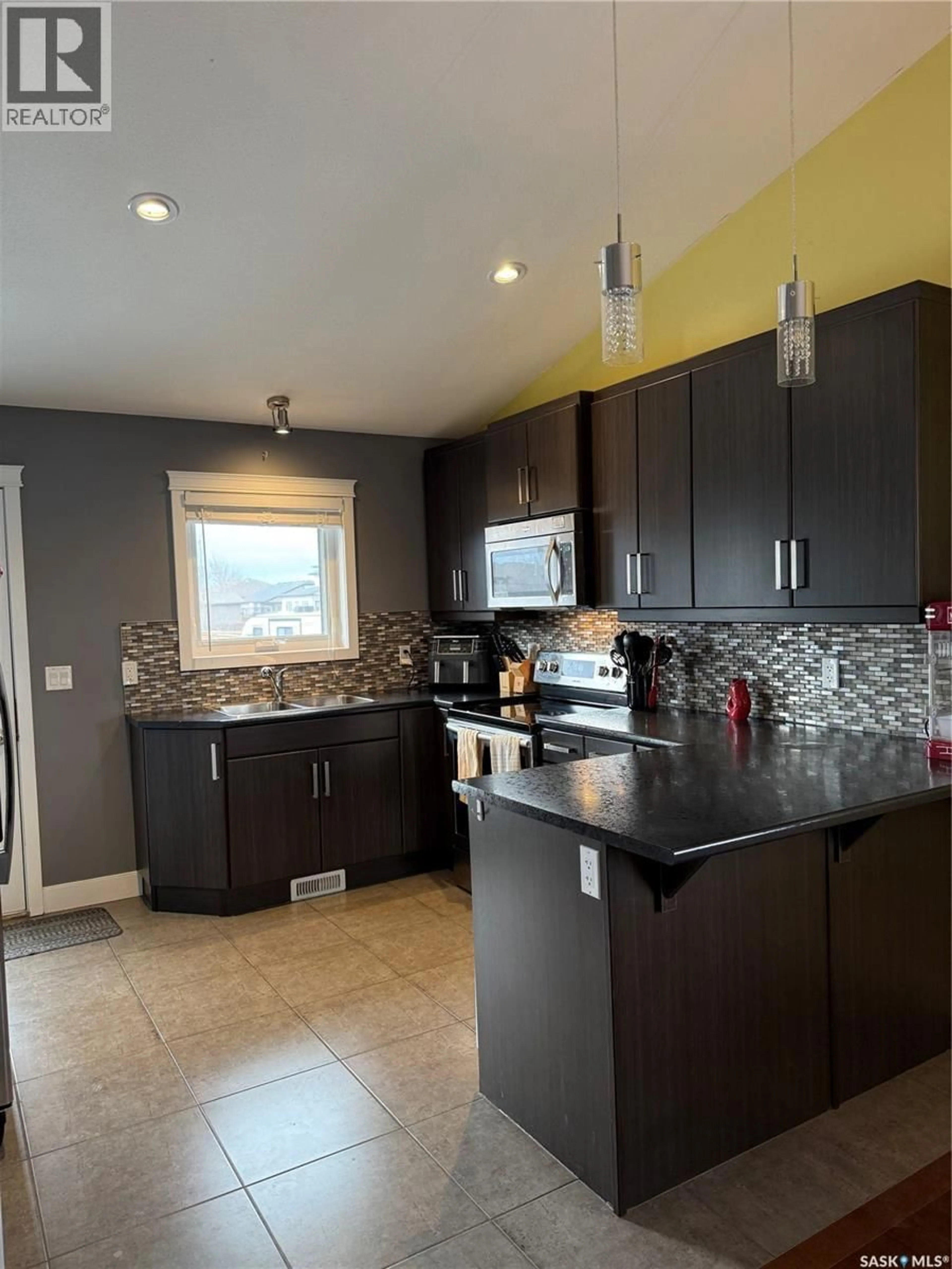 Open concept kitchen, ceramic/tile floor for 501 REDWOOD CRESCENT, Warman Saskatchewan S0K4S2