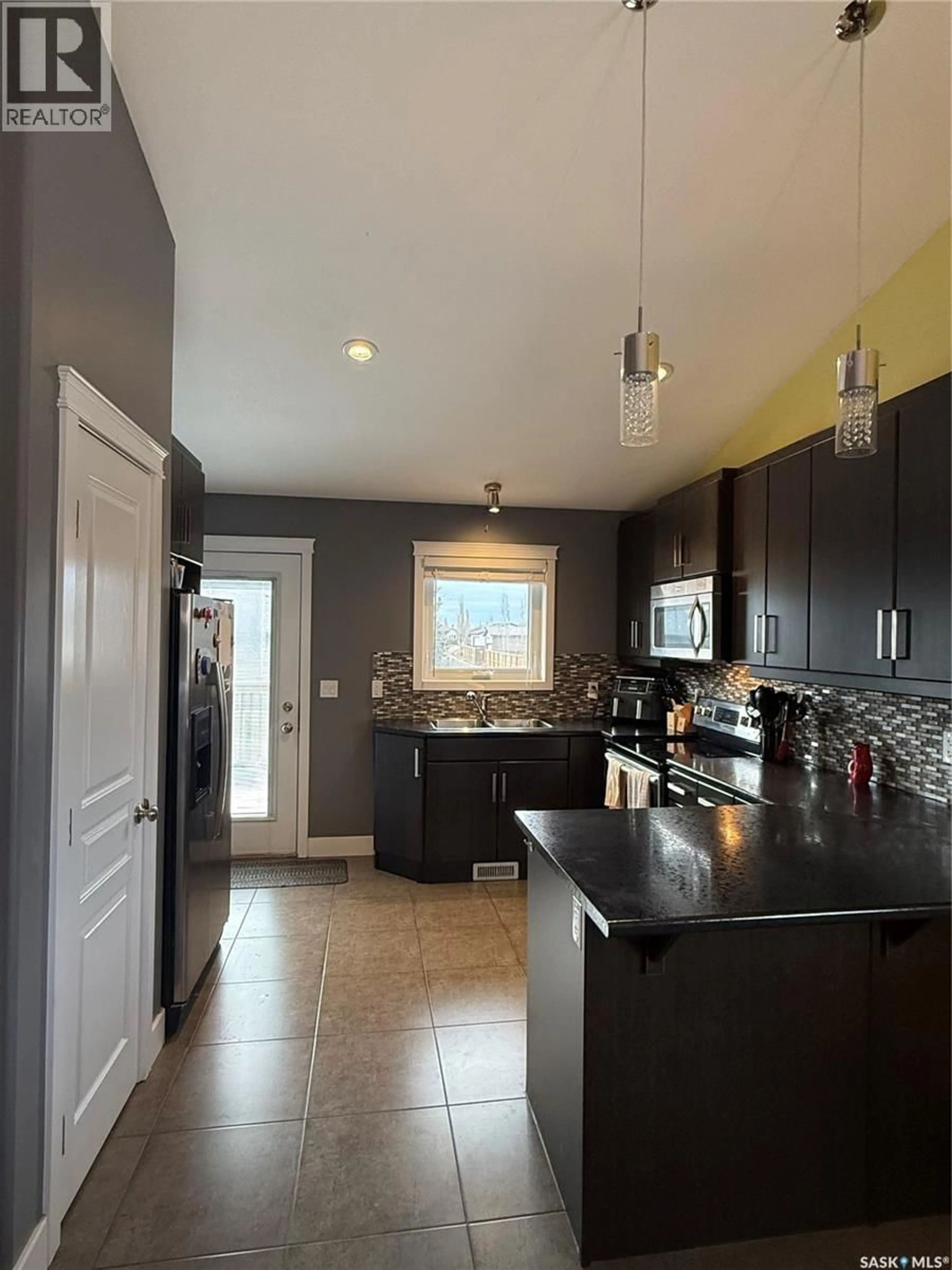 Open concept kitchen, ceramic/tile floor for 501 REDWOOD CRESCENT, Warman Saskatchewan S0K4S2
