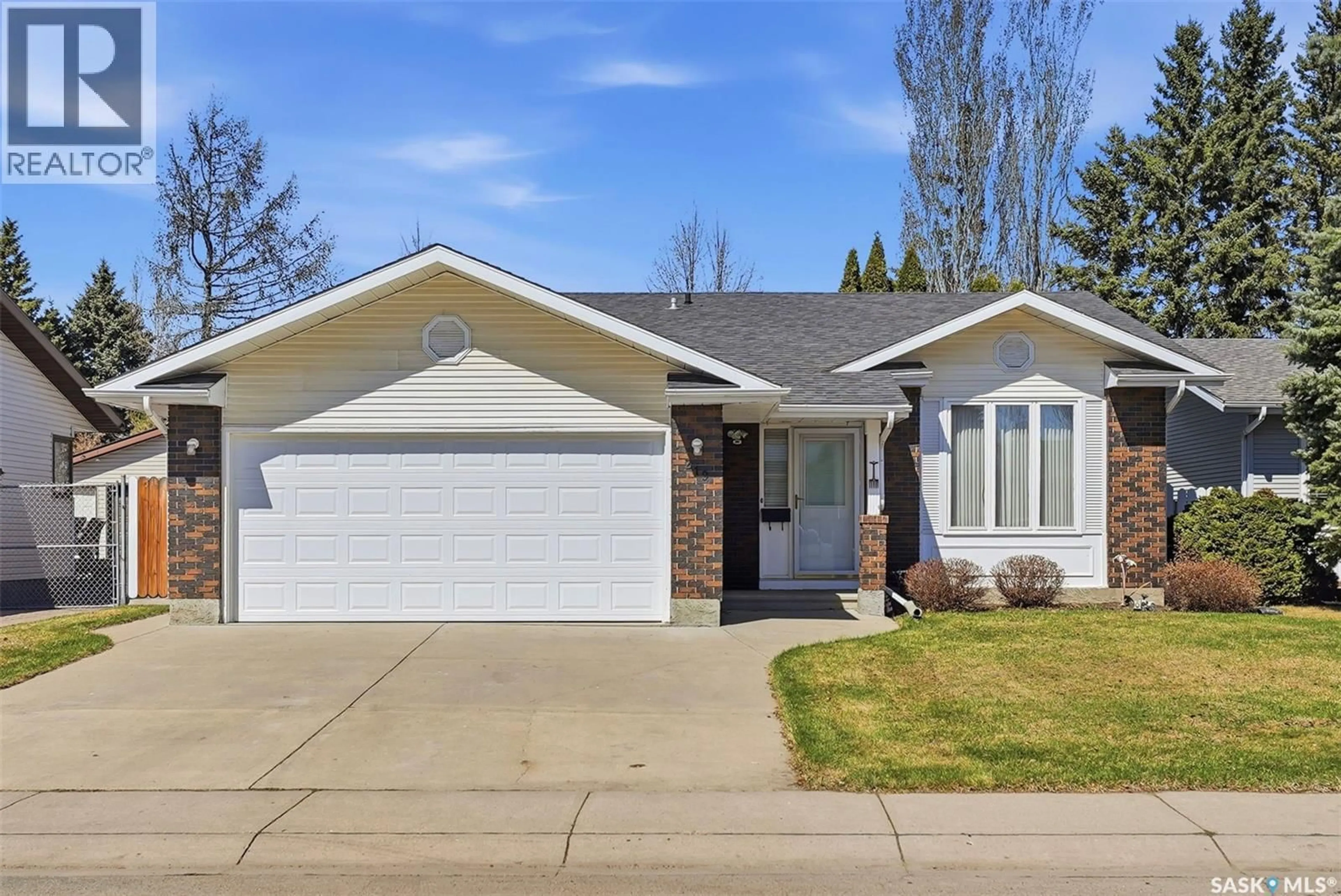 Home with vinyl exterior material, street for 219 BRONSON WAY, Saskatoon Saskatchewan S7J5C9