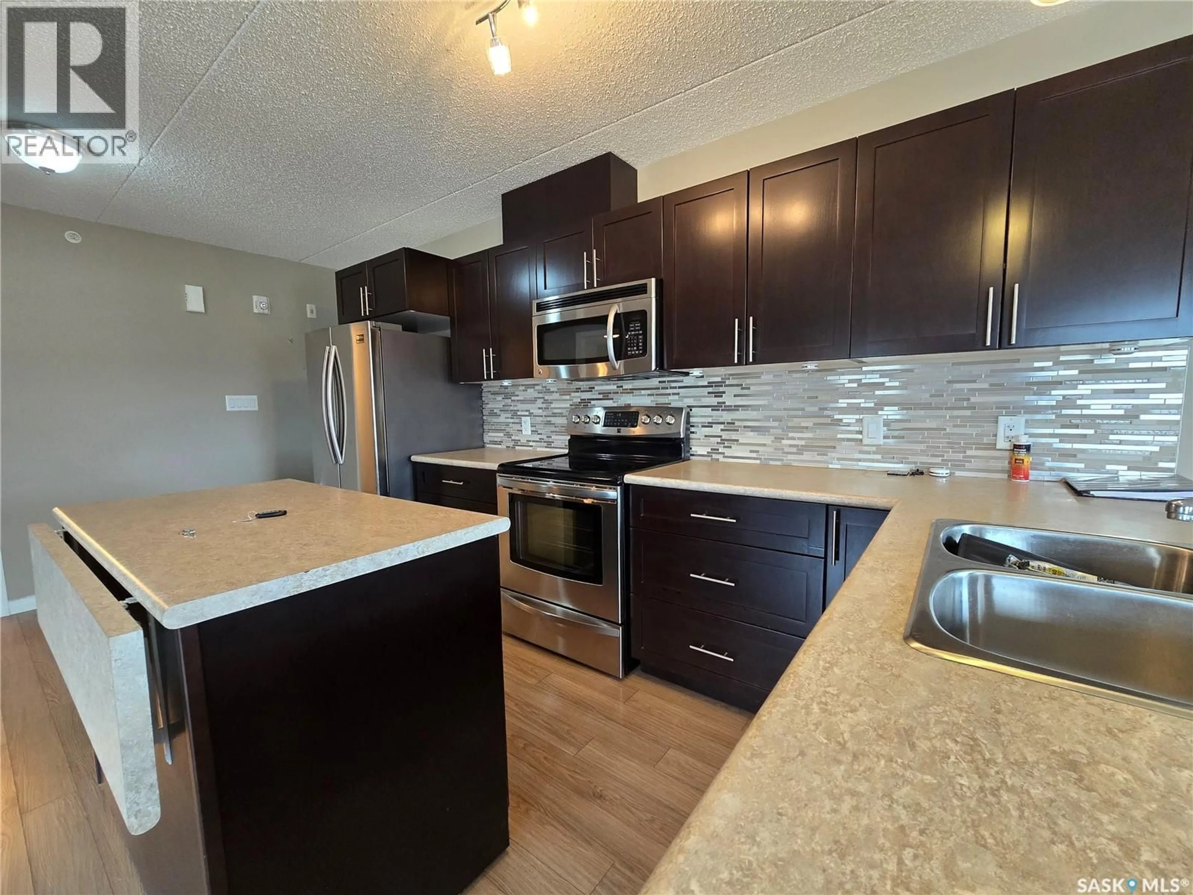 Open concept kitchen, unknown for 208 - 505 BANNERMAN STREET, Weyburn Saskatchewan S4H1V5