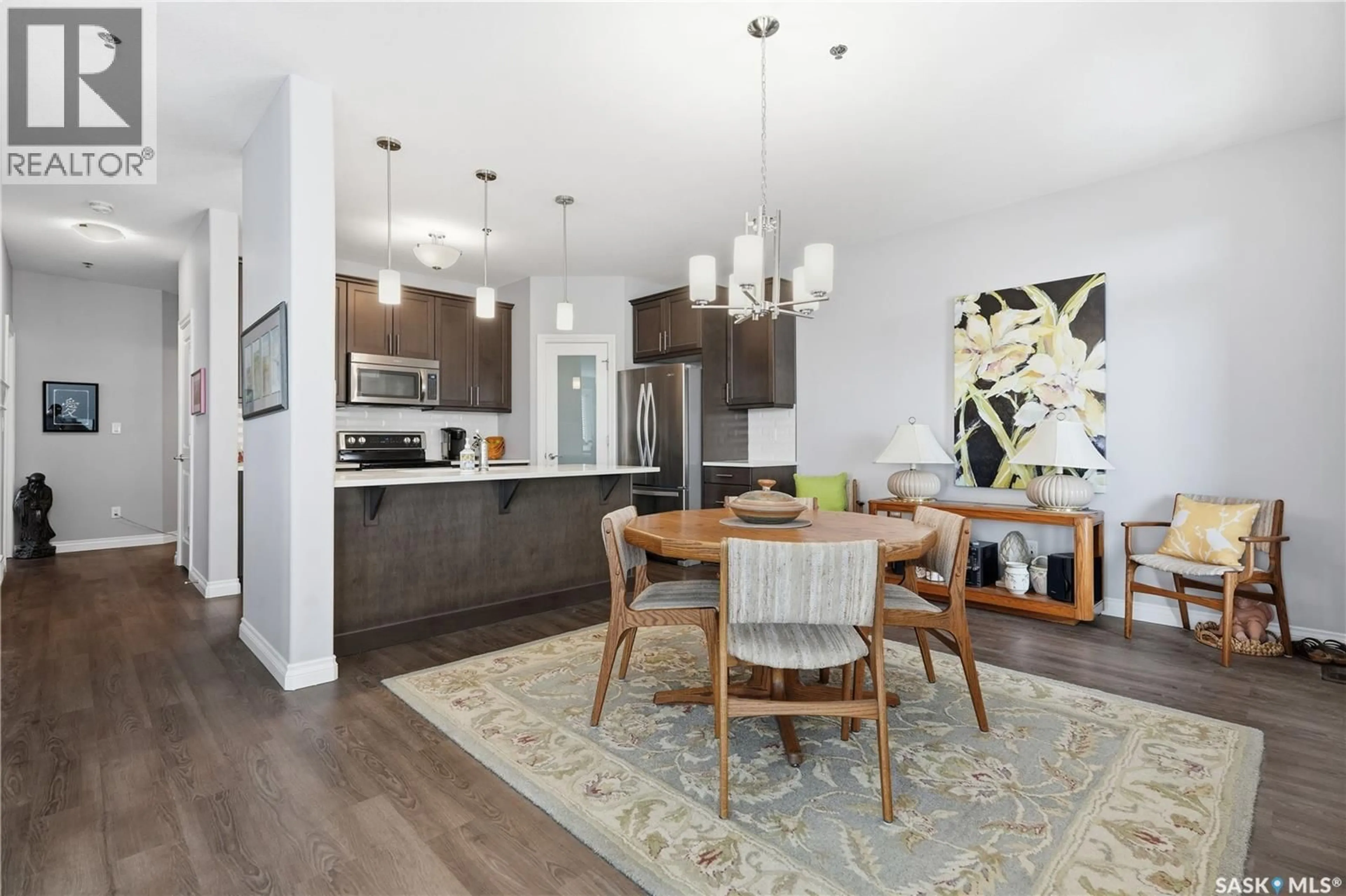 Open concept kitchen, wood/laminate floor for 302 - 4570 HARBOUR LANDING DRIVE, Regina Saskatchewan S4W0R8