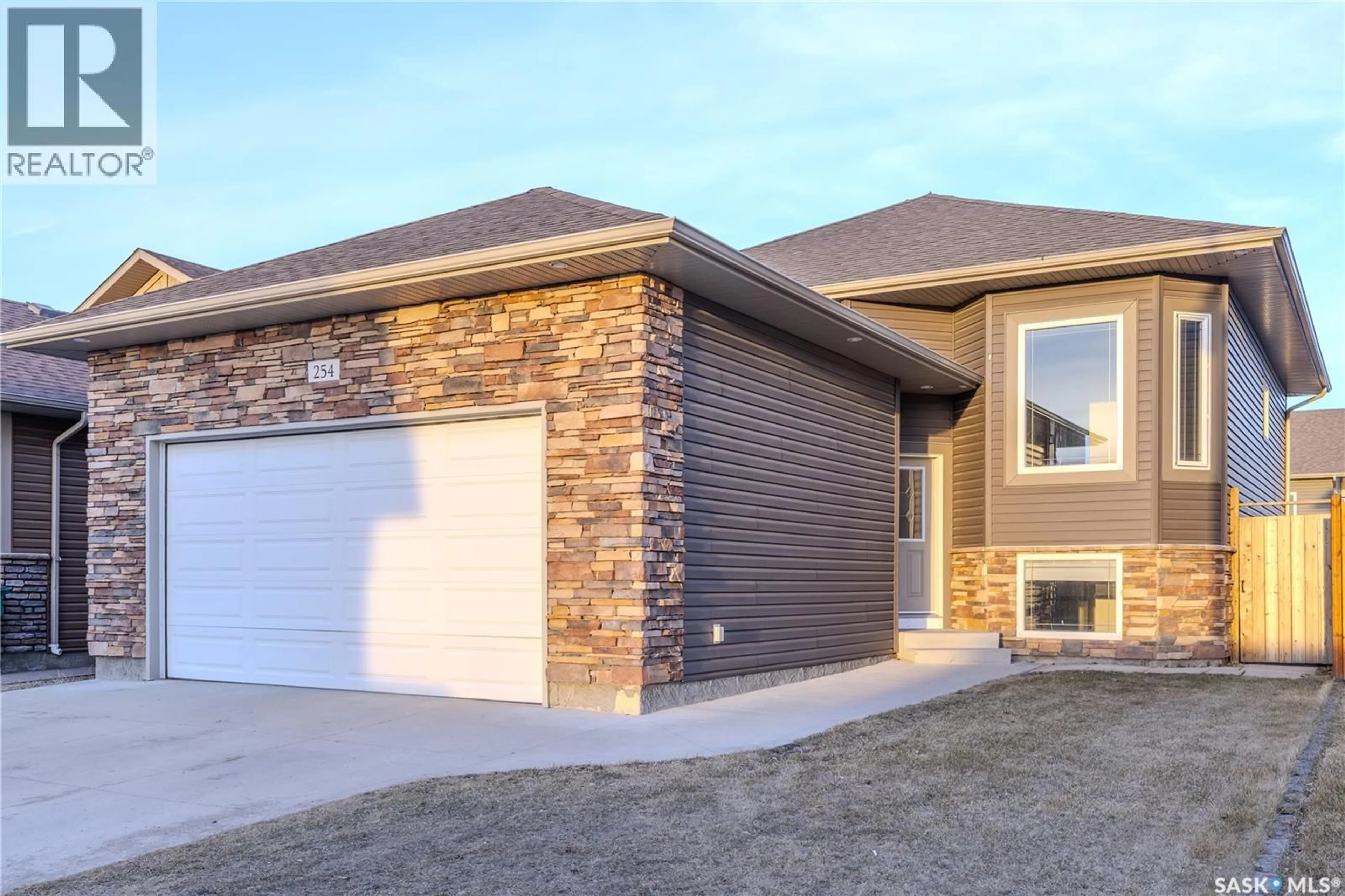 Home with brick exterior material, street for 254 MACINNES STREET, Saskatoon Saskatchewan S7T0T2